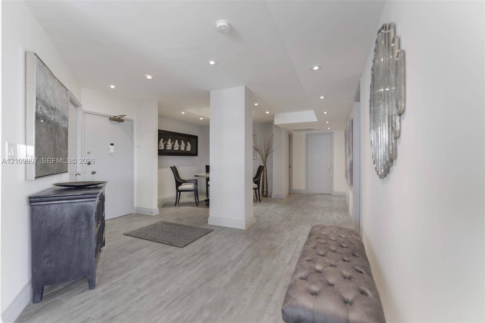 1980 S Ocean Drive, #16Q, Hallandale Beach, FL 33009 Interior foyer featuring recessed lighting, wood-finish flooring, and crisp white wall finishes
