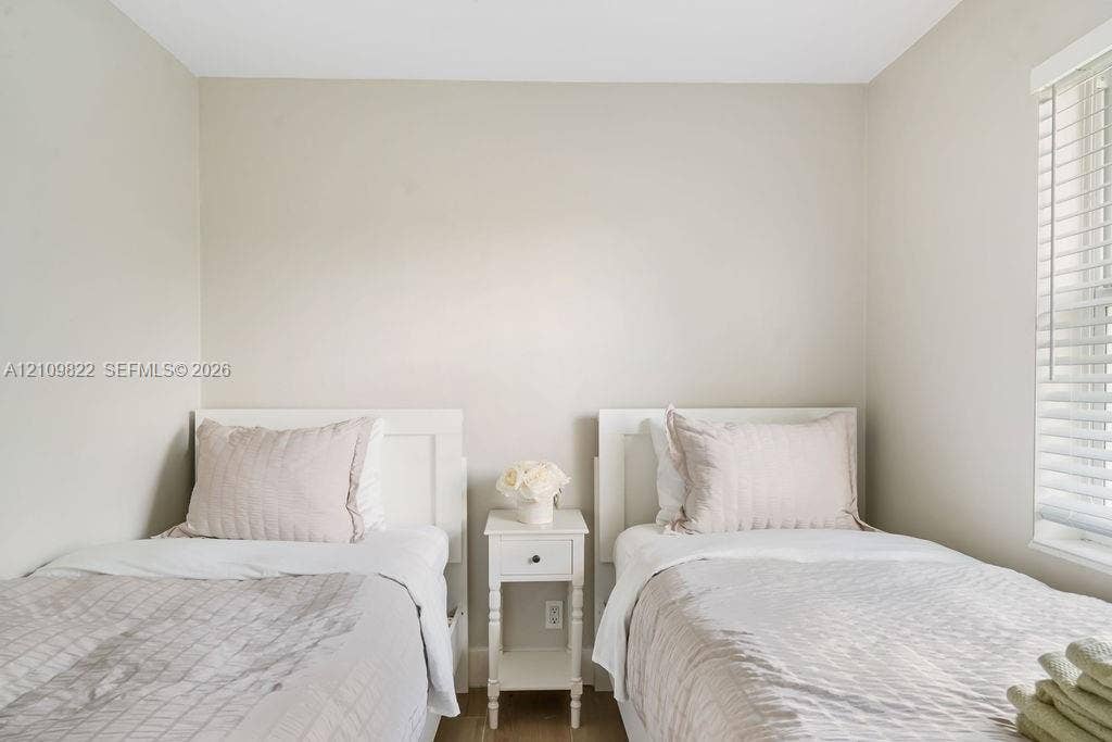 913 Lighthouse Drive, North Palm Beach, North Palm Beach, FL 33408 Neutral wall palette, wood-finish flooring, and horizontal window blinds