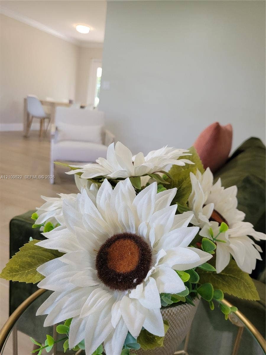 913 Lighthouse Drive, North Palm Beach, North Palm Beach, FL 33408 Neutral wall tones, wood-finish flooring, and crown molding