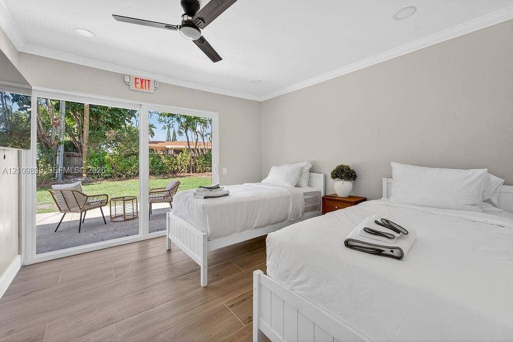 756 Cinnamon Road, North Palm Beach, North Palm Beach, FL 33408 Wood-finish flooring, sliding glass patio doors, recessed lighting, and a modern ceiling fan