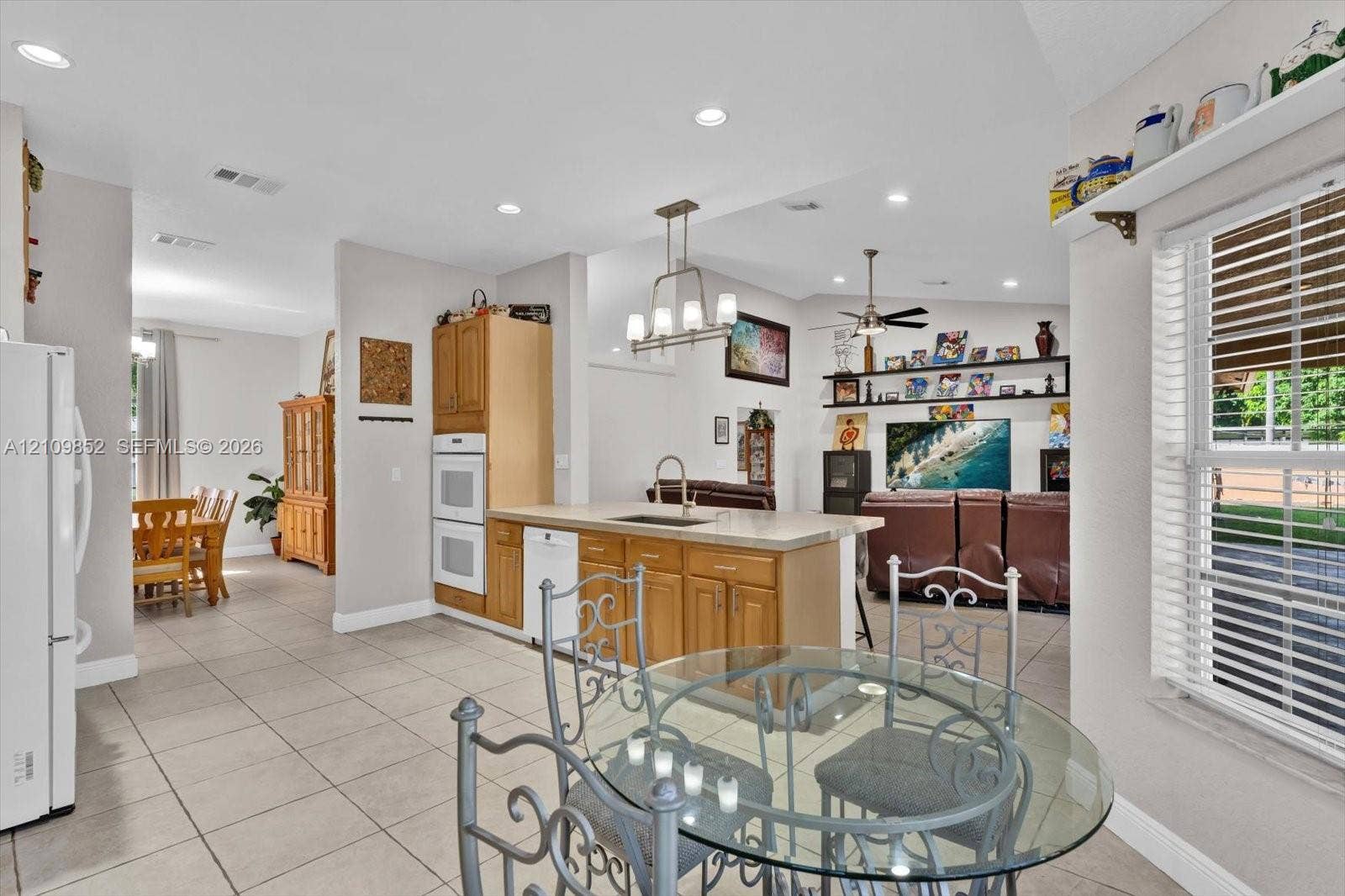 7901 SW 97th Street, Miami, FL 33156 Kitchen featuring light-finish solid wood cabinetry and built-in double wall ovens *