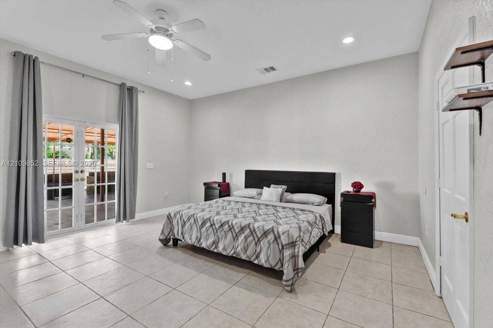 7901 SW 97th Street, Miami, FL 33156 Main bedroom with double French doors leading to the covered patio *