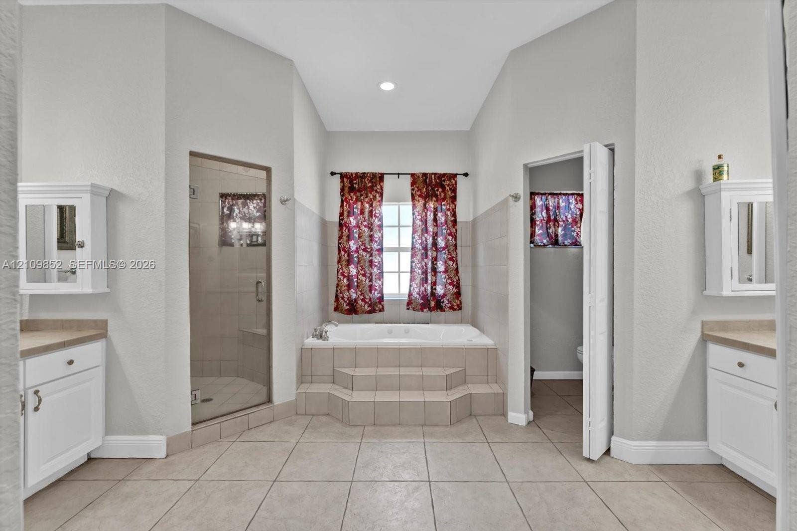 7901 SW 97th Street, Miami, FL 33156 Soaking/spa tub with a separate glass-enclosed shower designed with multi high powered water jets, and dual vanities *
