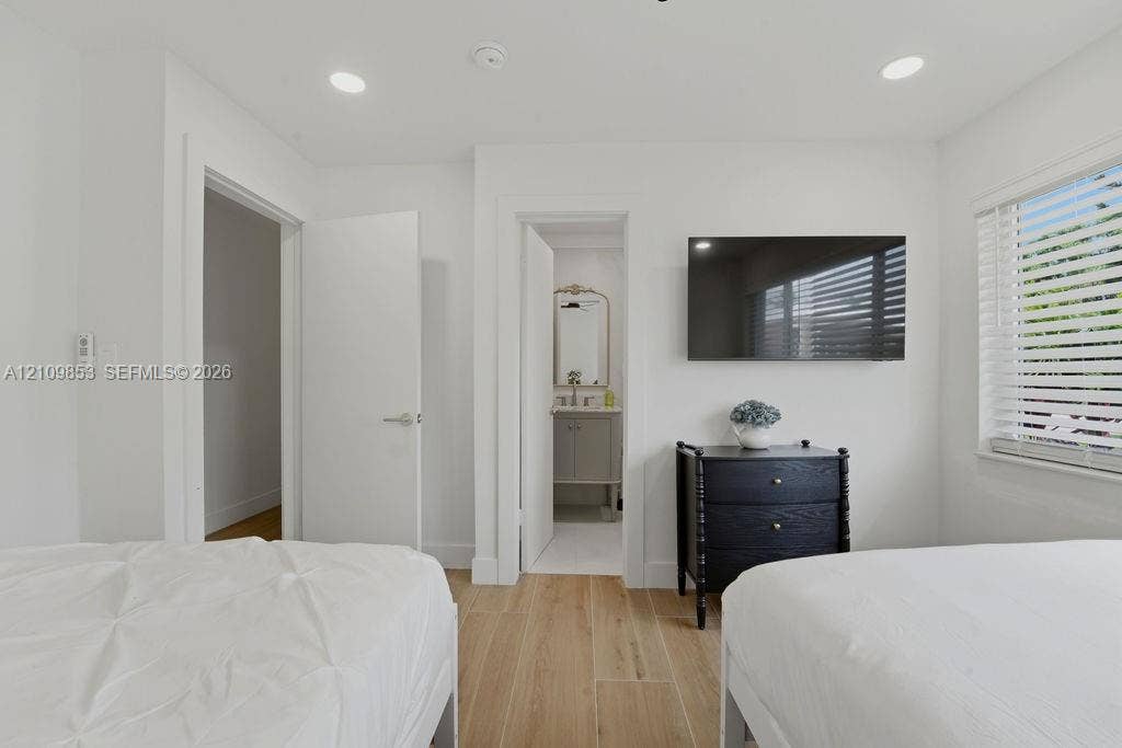800 Alamanda Drive, North Palm Beach, North Palm Beach, FL 33408 Wood-finish flooring, recessed lighting, and horizontal window blinds