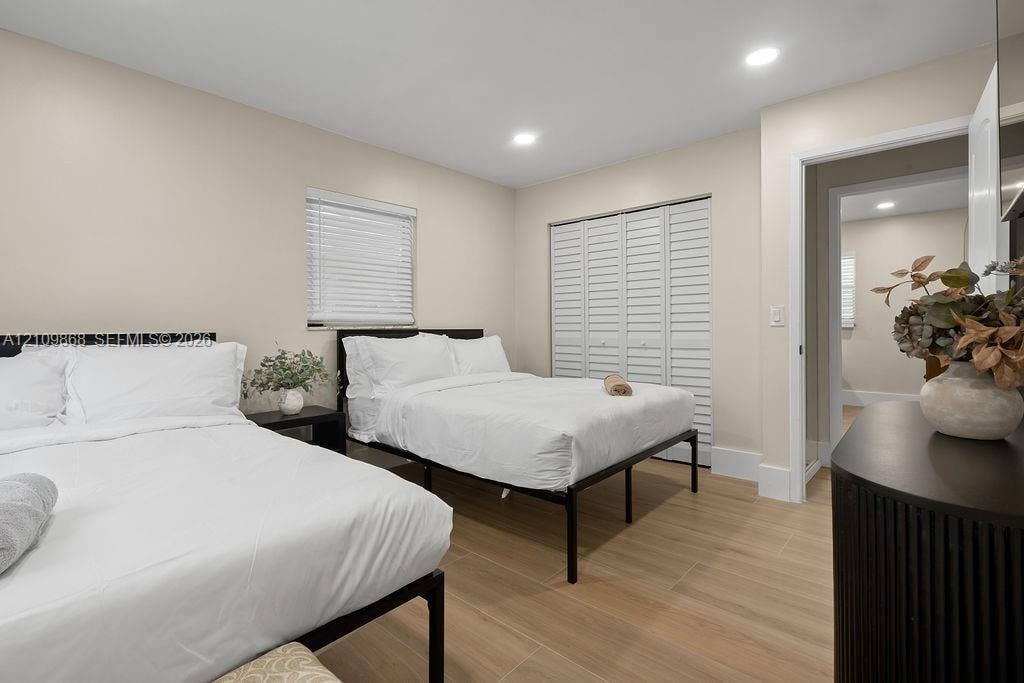736 Prosperity Farms Road, North Palm Beach, North Palm Beach, FL 33408 Wood-finish tile flooring, recessed ceiling lighting, and folding louvered closet doors