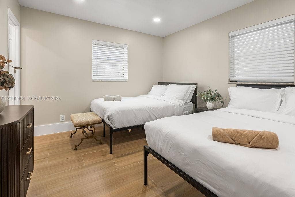 736 Prosperity Farms Road, North Palm Beach, North Palm Beach, FL 33408 Neutral-toned interior space featuring wood-finish flooring, recessed lighting, and horizontal window blinds