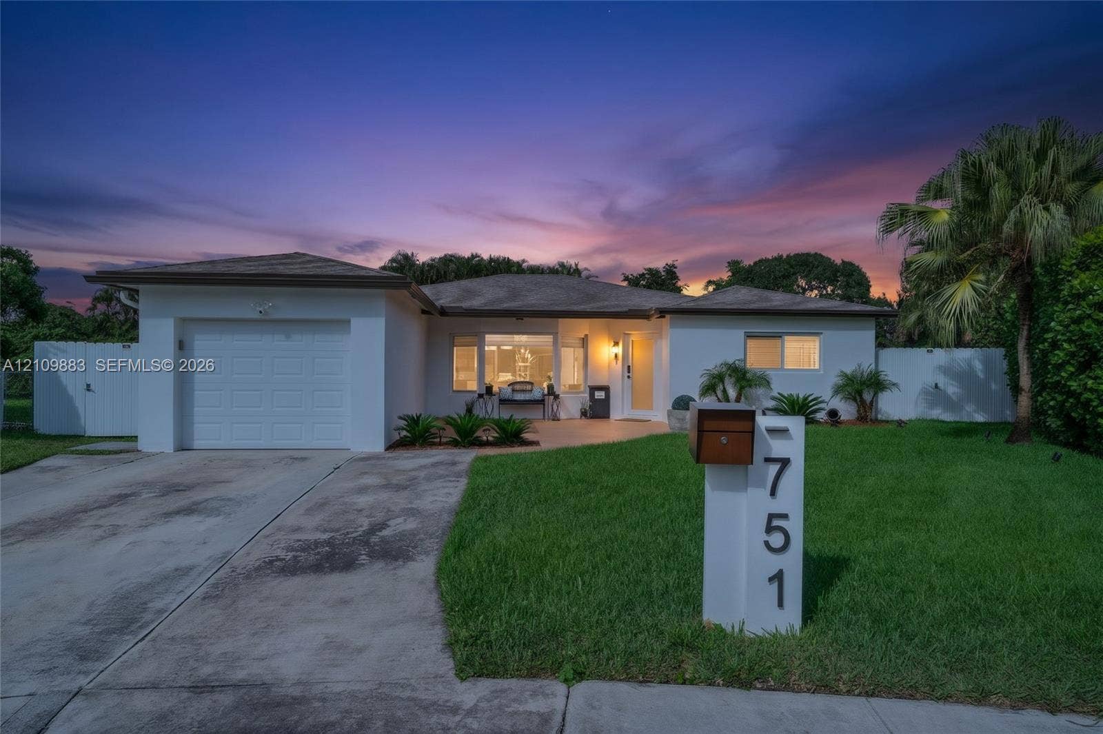 751 SW 54th Avenue, Margate, FL 33068 Single-story residence featuring a stucco exterior, integrated one-car garage, concrete driveway, and a front lawn with established landscaping