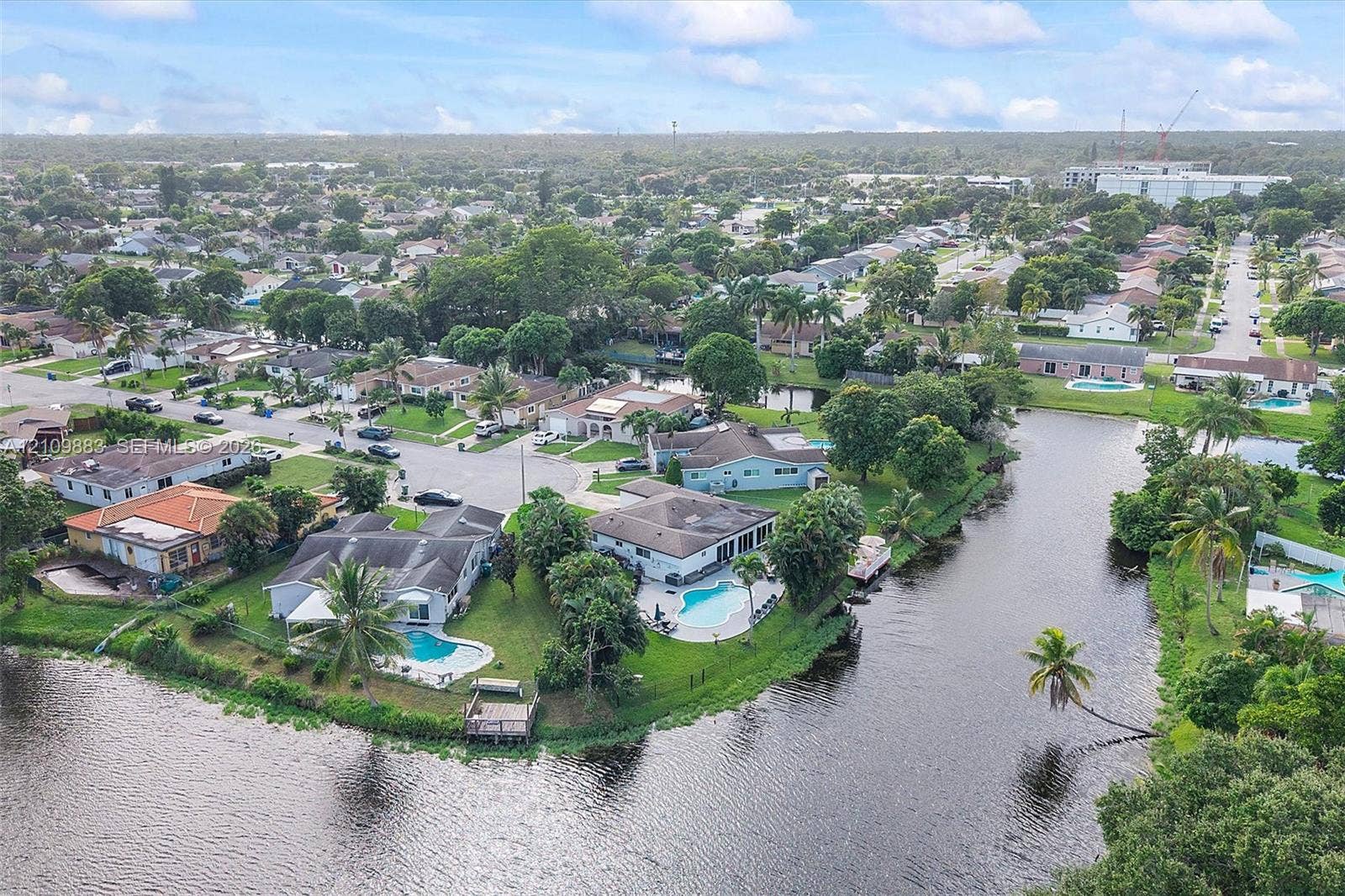 751 SW 54th Avenue, Margate, FL 33068 Waterfront residential properties featuring in-ground swimming pools, screened-in lanais, and private docks