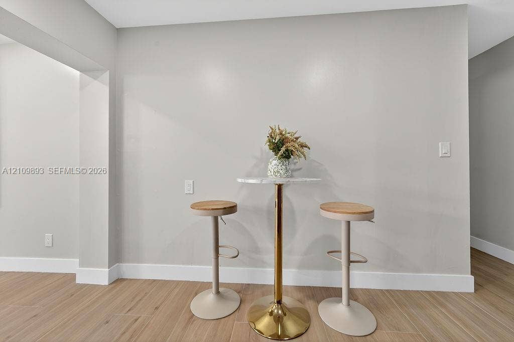 712 Tradewind Drive, North Palm Beach, North Palm Beach, FL 33408 Neutral wall tones paired with wood-finish flooring