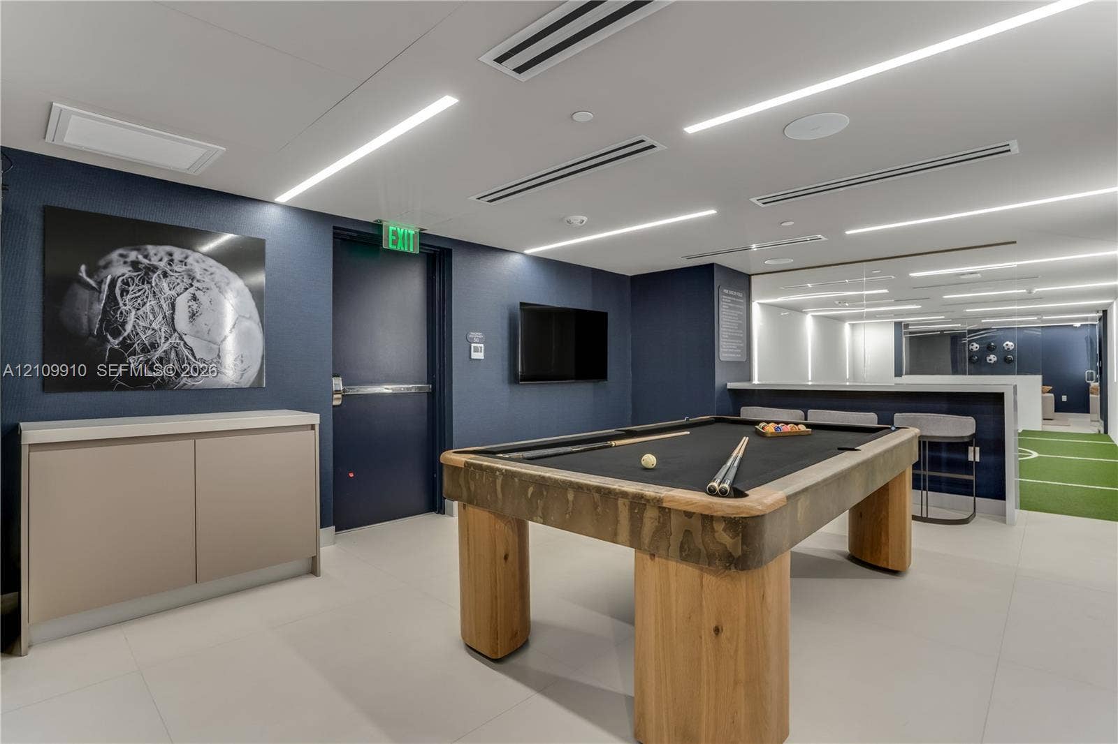 1170 E Hallandale Beach Boulevard, #908, Hallandale Beach, FL 33009 Large-format tile flooring, recessed linear LED lighting, and built-in minimalist cabinetry