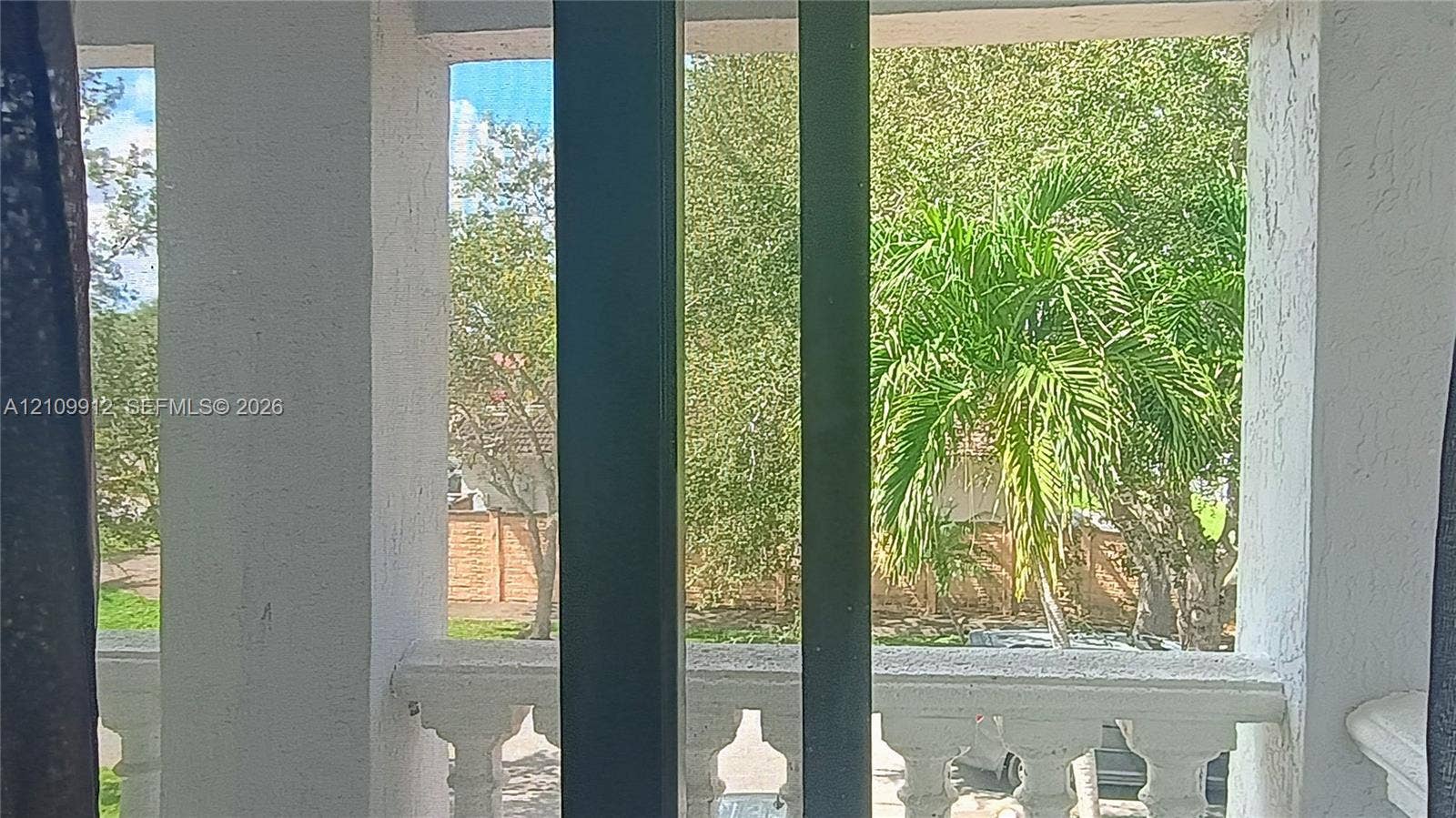 3253 SW 150 Court, Miami, FL 33185 Covered balcony featuring white masonry balusters and vertical structural columns