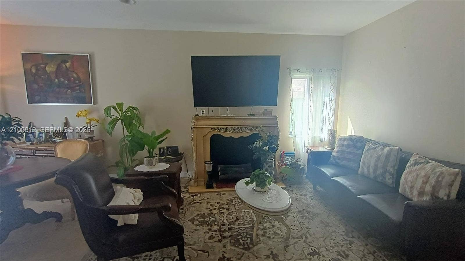 3253 SW 150 Court, Miami, FL 33185 Ornate fireplace mantle with decorative carved detailing and recessed firebox