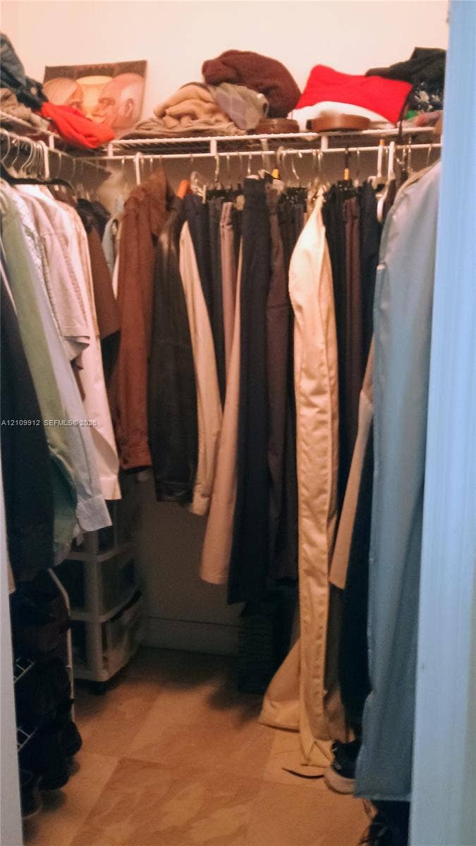 3253 SW 150 Court, Miami, FL 33185 Walk-in closet featuring wire shelving and tile flooring