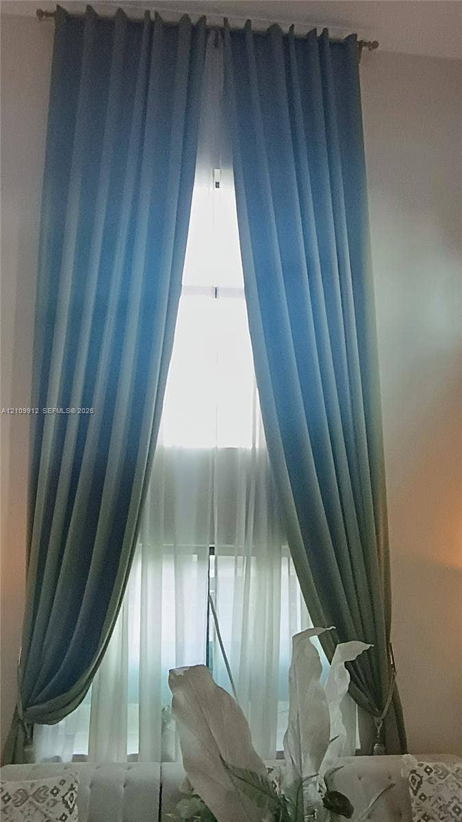 3253 SW 150 Court, Miami, FL 33185 Floor-to-ceiling window featuring a metal curtain rod and hardware