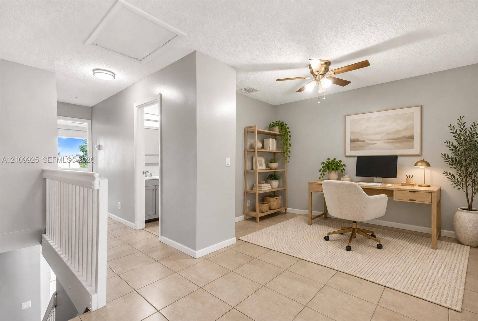 9807 NW 57th Manor, Coral Springs, Coral Springs, FL 33076 Open-concept space featuring tile flooring, neutral wall paint, and a ceiling fan with integrated lighting