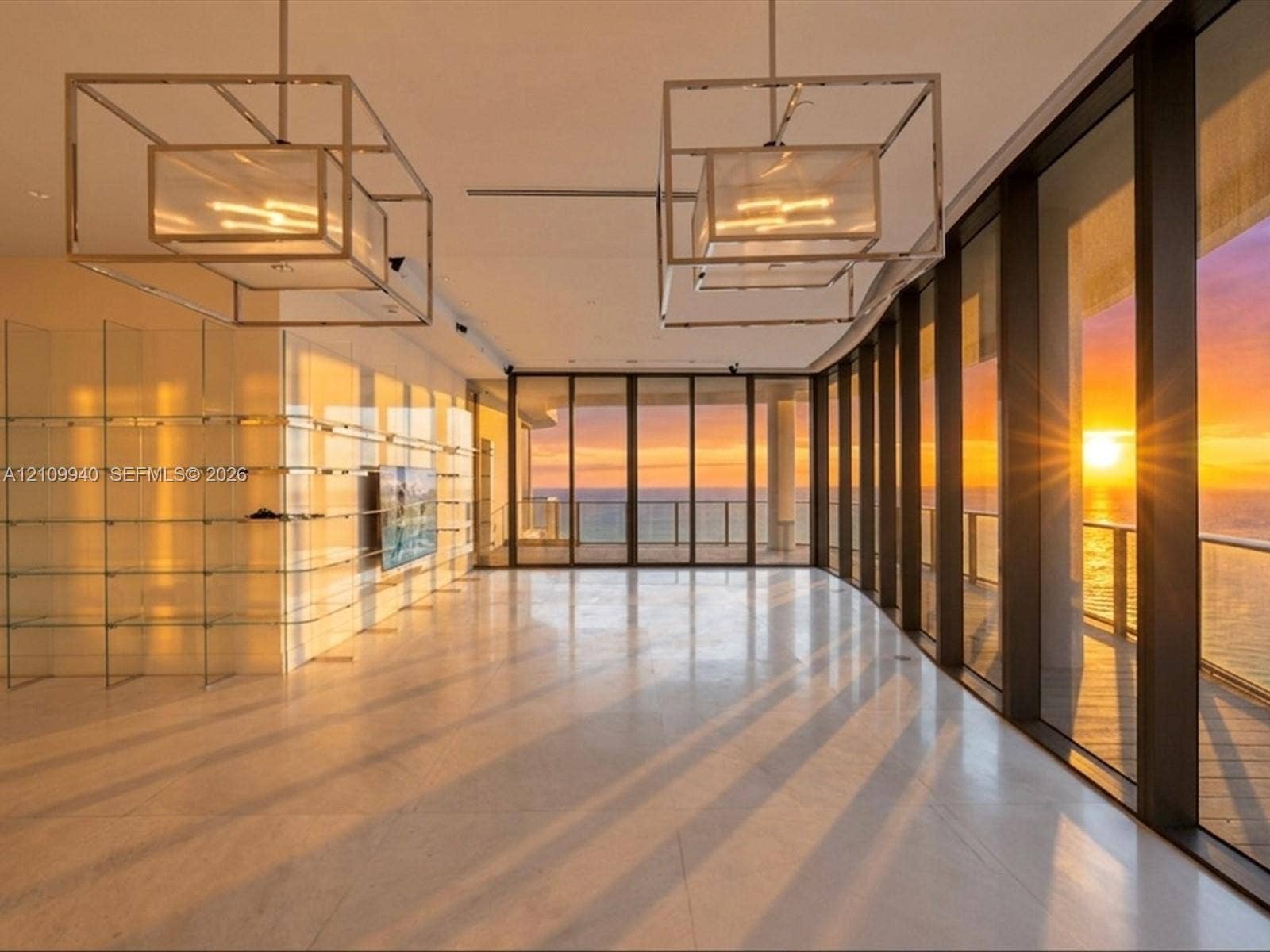 Floor-to-ceiling glass walls, large-format tile flooring, dual geometric metal pendant light fixtures, and built-in glass shelving
