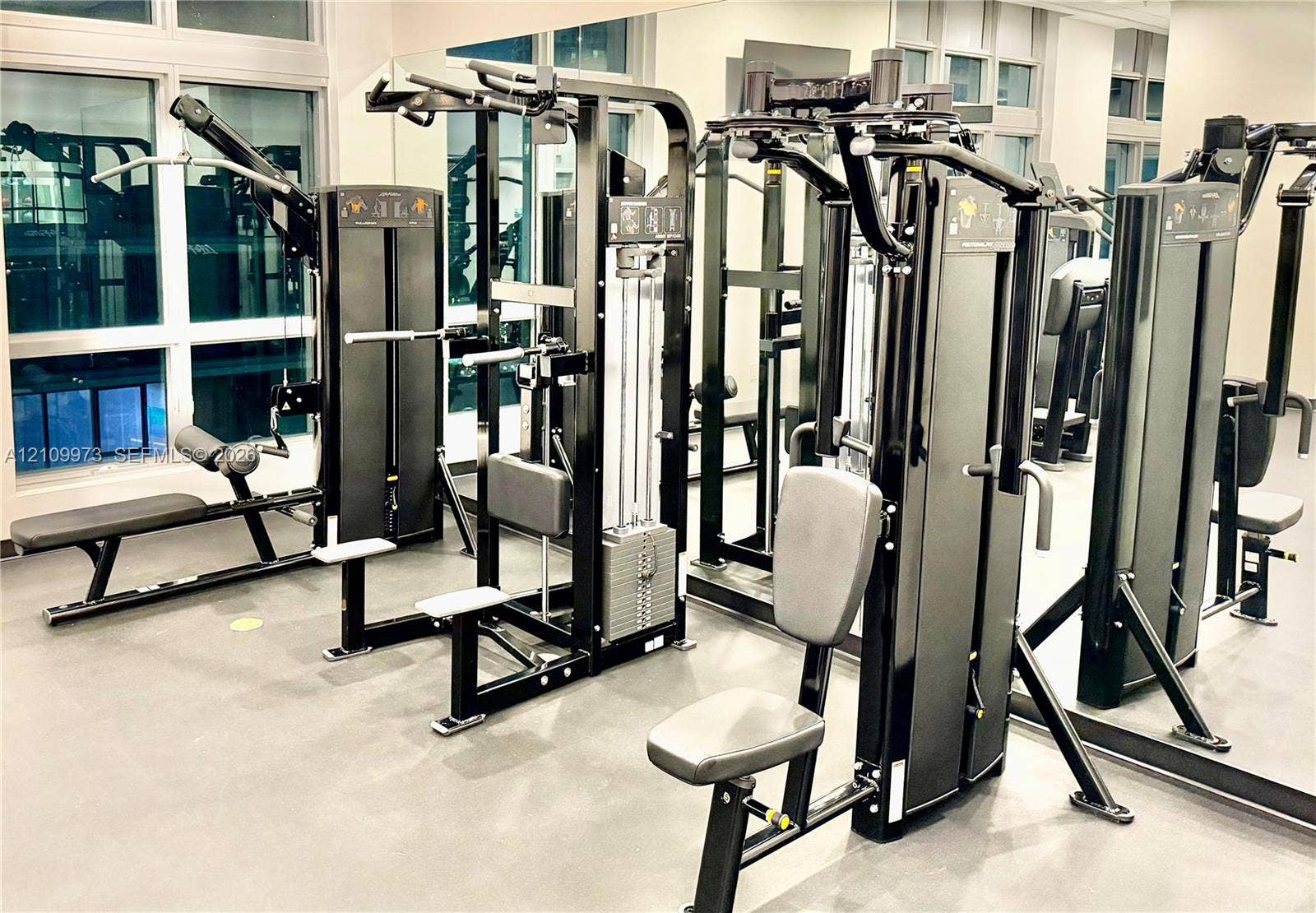 300 S Biscayne Boulevard, #T-1806, Miami, Miami, FL 33131 Fitness center featuring large-scale floor-to-ceiling mirrors and expansive multi-pane windows