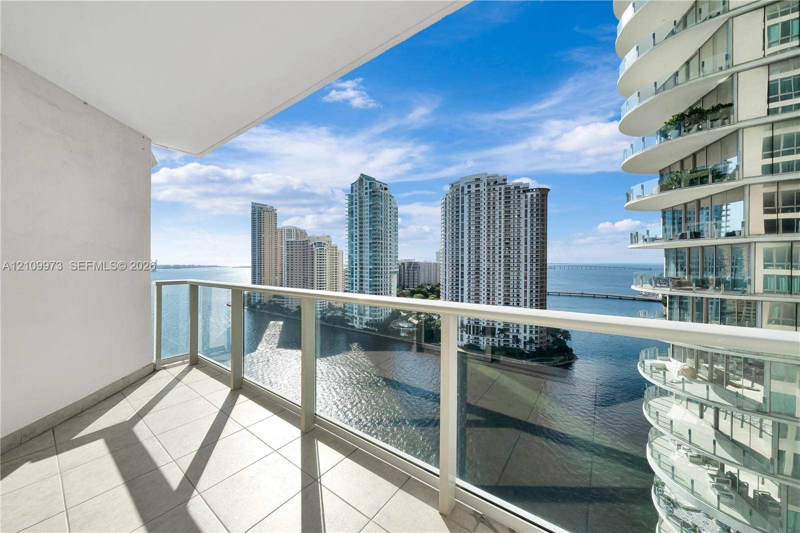 300 S Biscayne Boulevard, #T-1806, Miami, Miami, FL 33131 Private balcony featuring white tile flooring and a glass panel railing