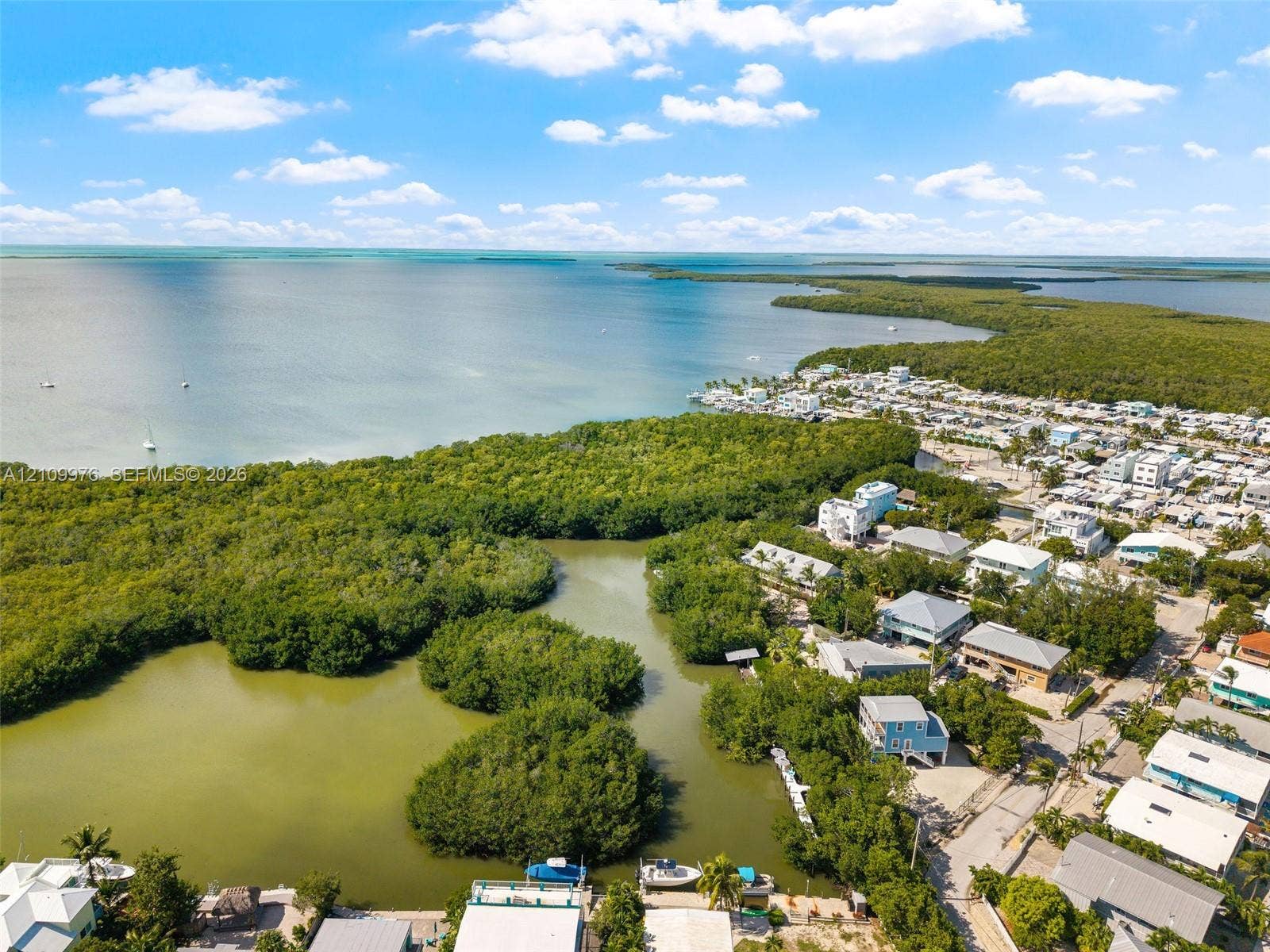43 Waterways Drive, Key Largo, FL 33037 Aerial perspective featuring open water frontage, natural mangrove coastline, and proximity to coastal waterways
