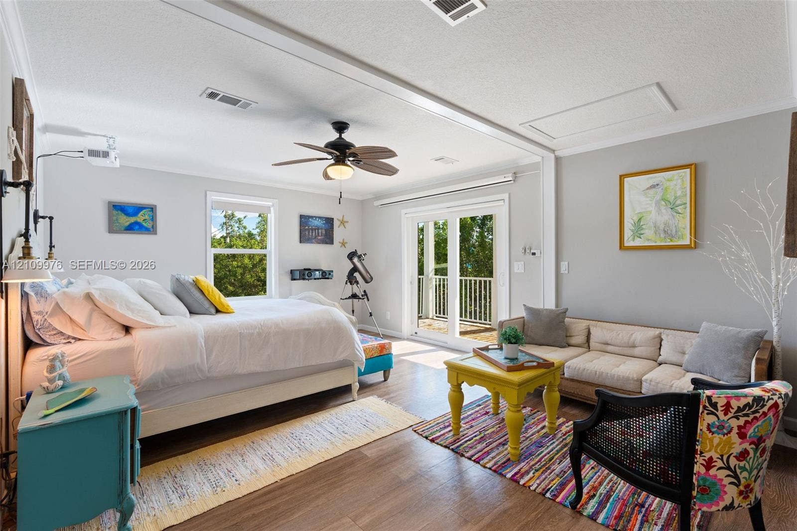 43 Waterways Drive, Key Largo, FL 33037 Spacious interior featuring wood-finish flooring, recessed lighting, a ceiling fan, and sliding glass doors with direct access to an exterior balcony