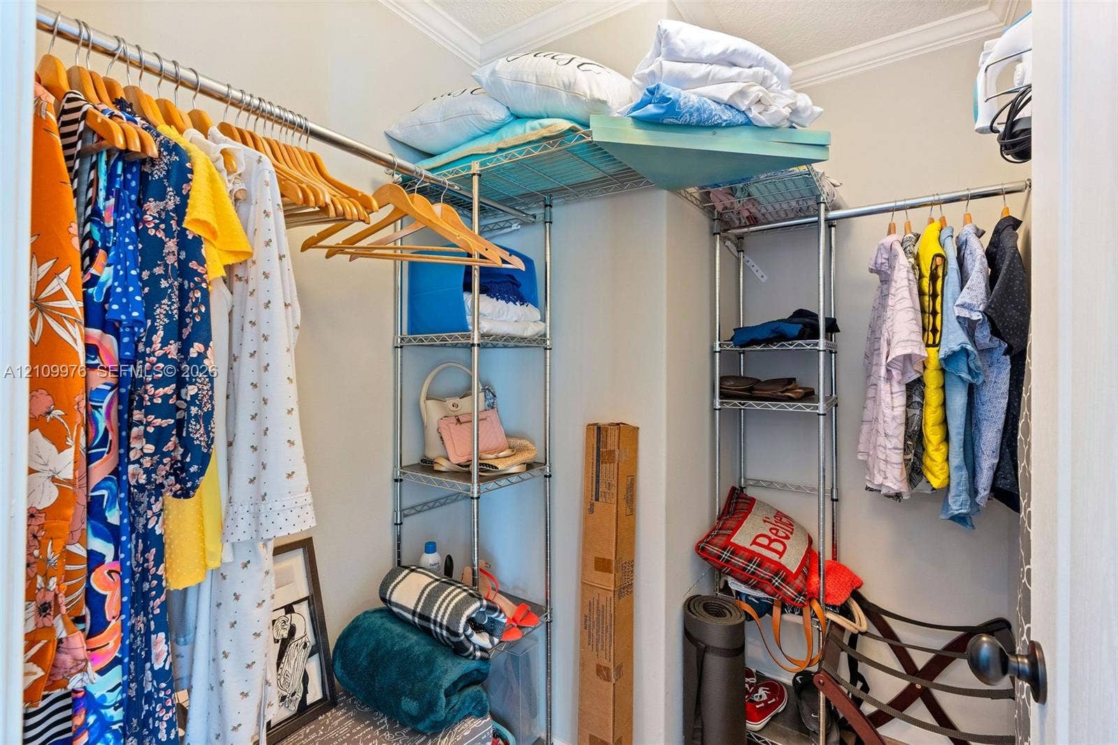43 Waterways Drive, Key Largo, FL 33037 Walk-in closet featuring floor-to-ceiling metal wire shelving and integrated garment rods
