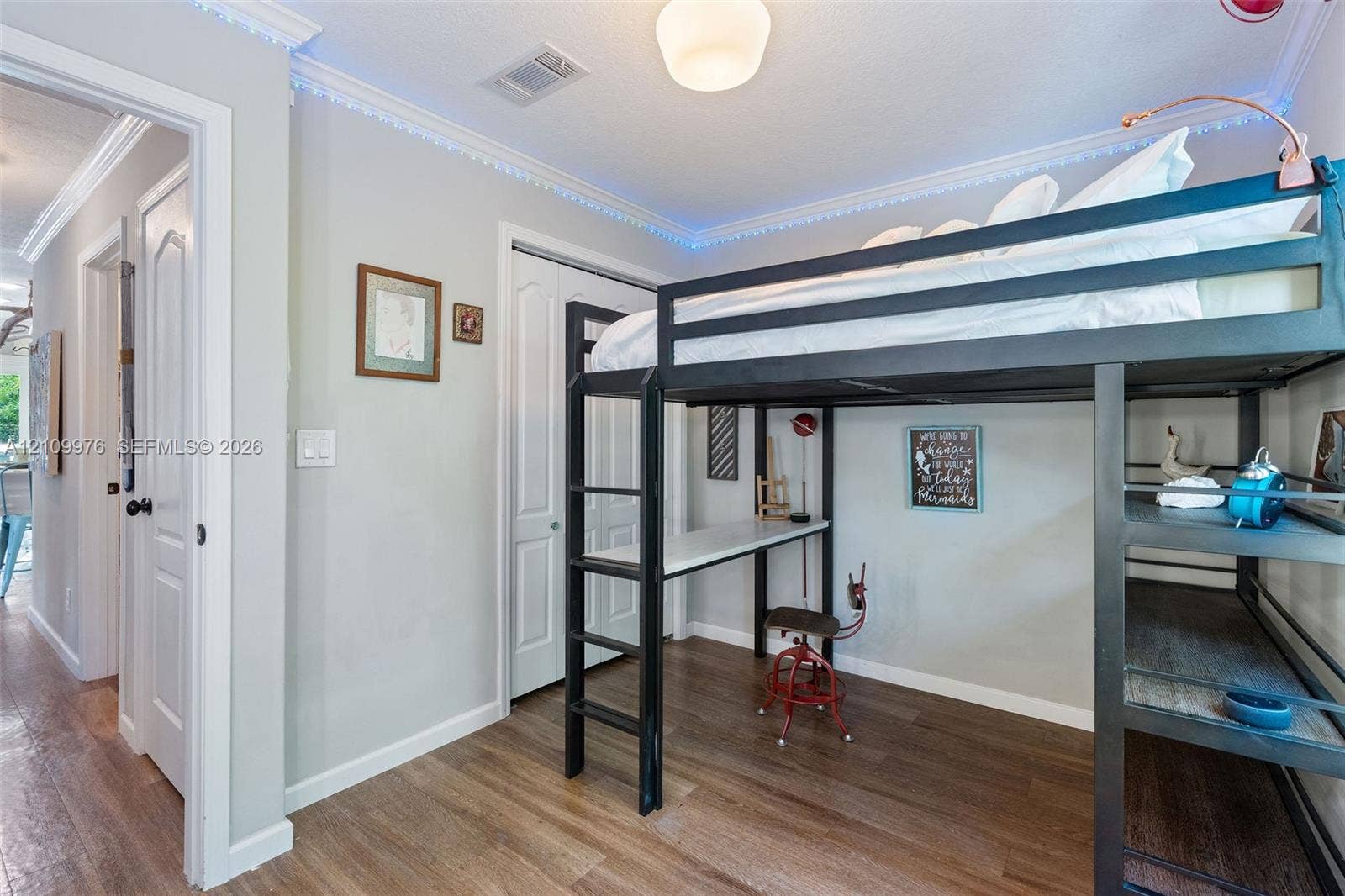 43 Waterways Drive, Key Largo, FL 33037 Room featuring wood-finish flooring, crown molding, and a double-door closet