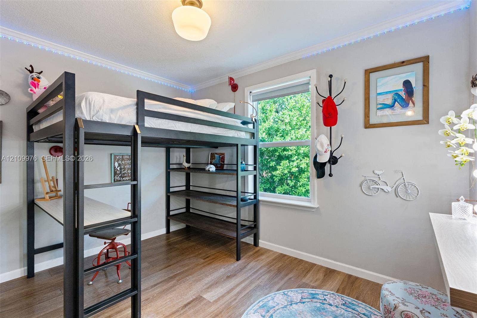 43 Waterways Drive, Key Largo, FL 33037 Wood-finish flooring, crown molding with integrated LED perimeter lighting, and a single-hung window