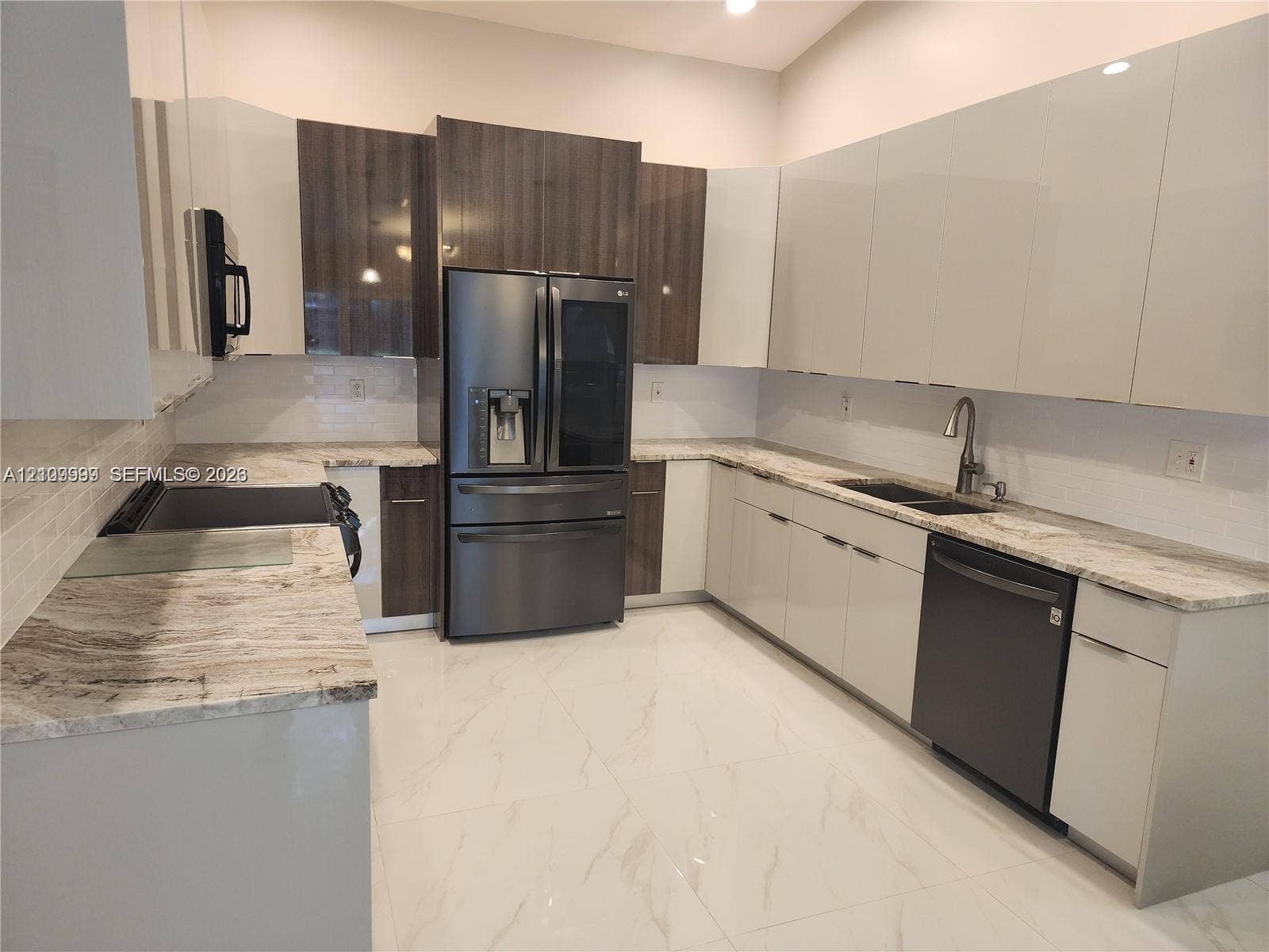 1794 NW 112th Terrace, Coral Springs, Coral Springs, FL 33071 Kitchen featuring two-tone cabinetry with high-gloss finishes, stone countertops, large-format tile flooring, a double-basin undermount sink, and stainless steel appliances