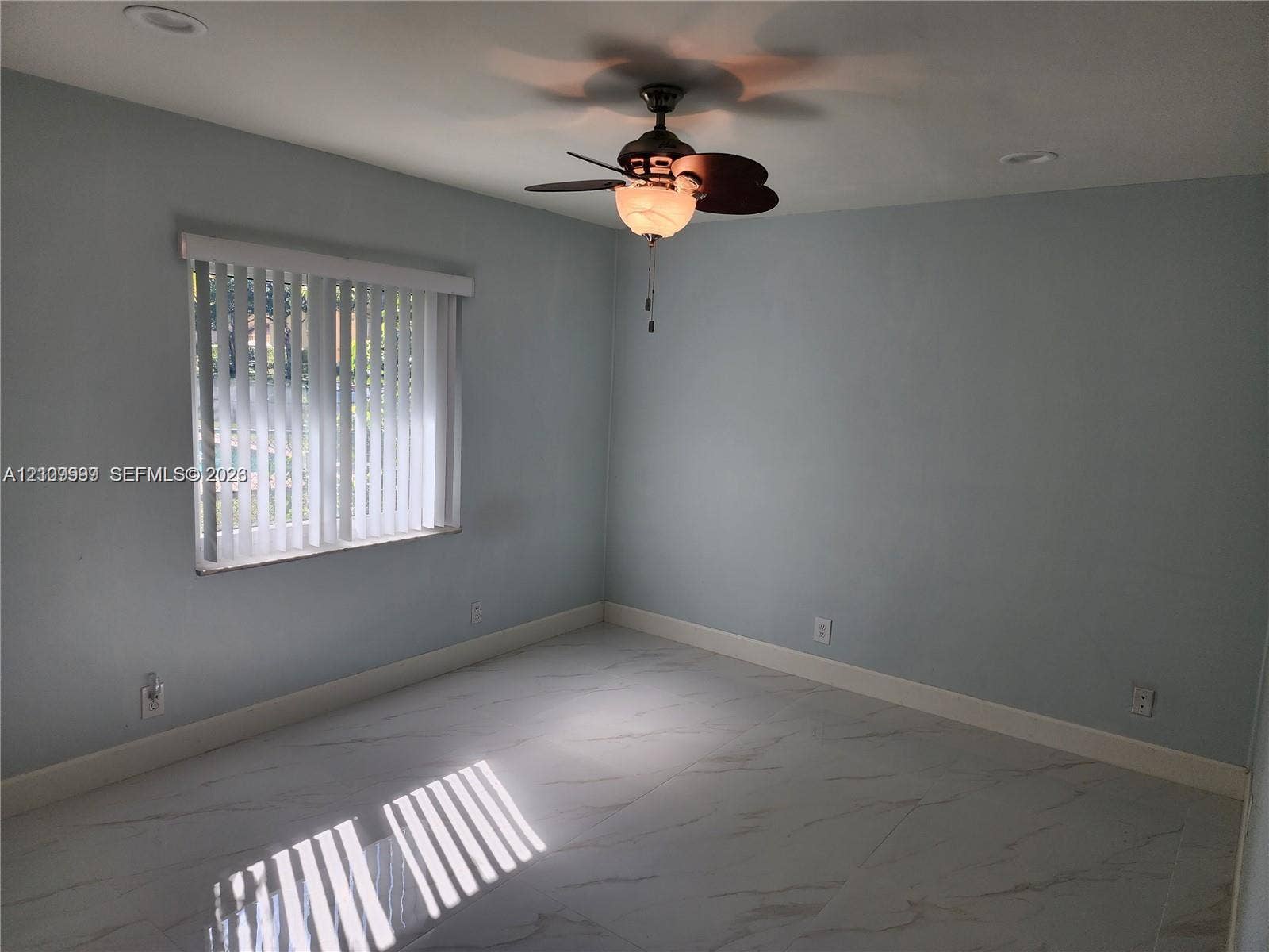 1794 NW 112th Terrace, Coral Springs, Coral Springs, FL 33071 Interior room featuring large-format tile flooring, recessed lighting, and a ceiling fan with integrated light fixture