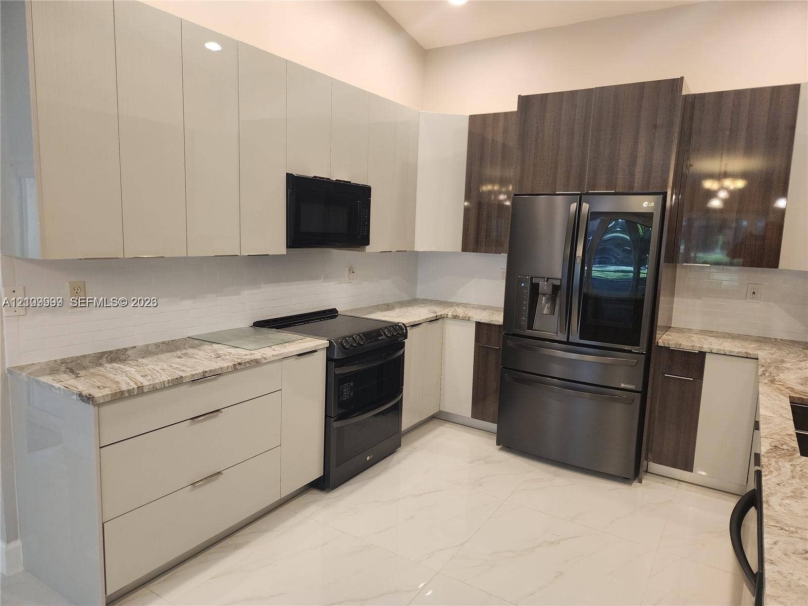 1794 NW 112th Terrace, Coral Springs, Coral Springs, FL 33071 Kitchen featuring two-tone high-gloss cabinetry, stone-finish countertops, tile backsplash, stainless steel appliances, and large-format floor tiling