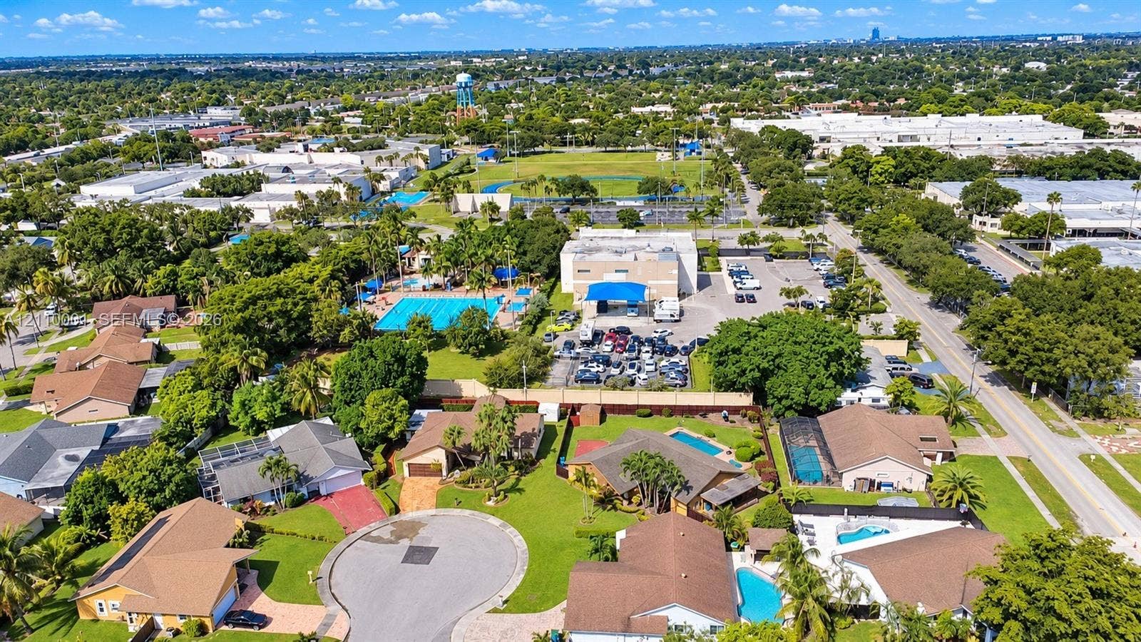 3617 SW 69th Terrace, #24-Z, Miramar, FL 33023 Aerial perspective of residential neighborhood featuring paved cul-de-sac streets, manicured lawns, and numerous properties with private screened-in swimming pools