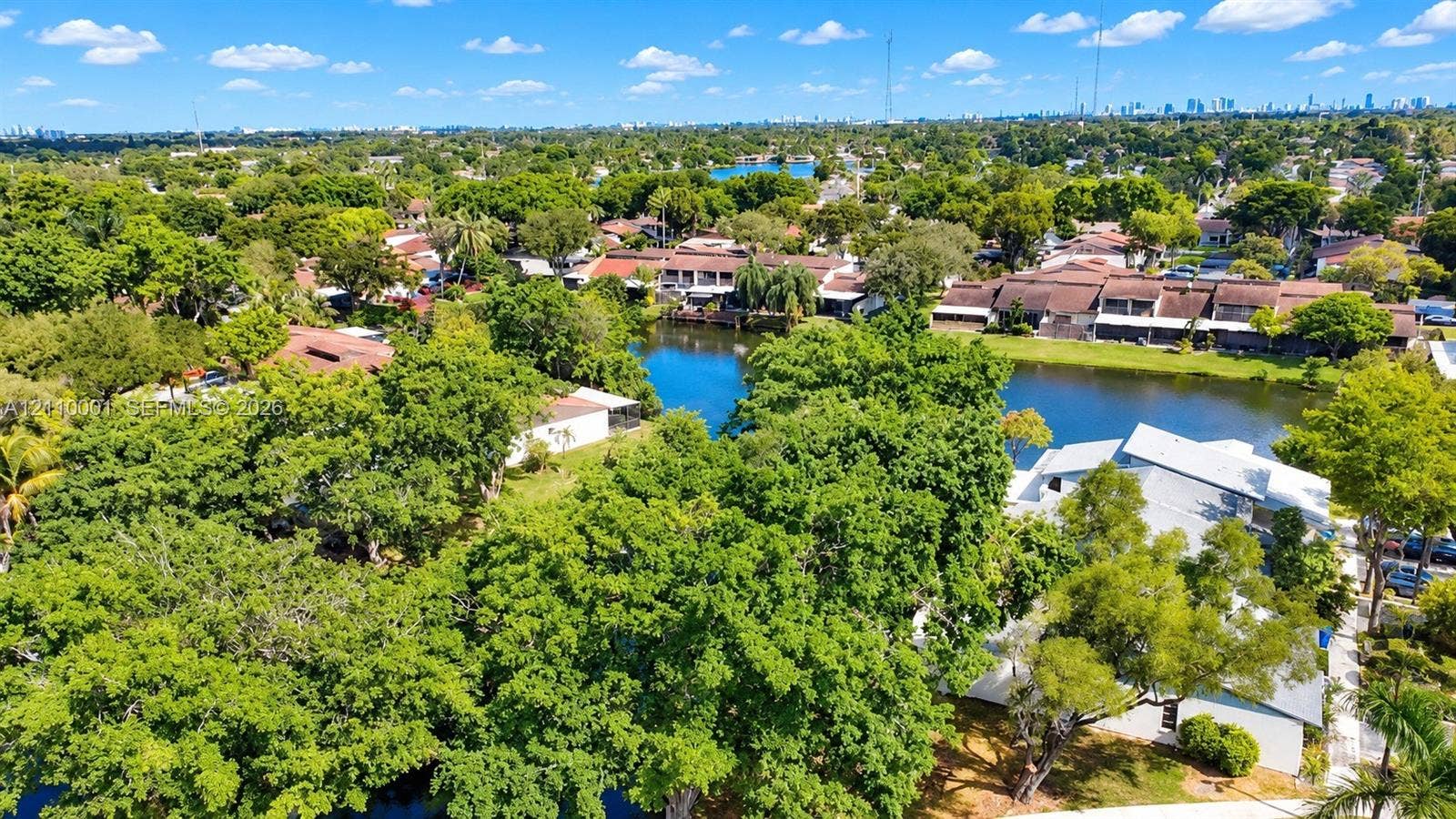 3617 SW 69th Terrace, #24-Z, Miramar, FL 33023 Aerial perspective featuring a waterfront setting, mature canopy trees, and established landscaping