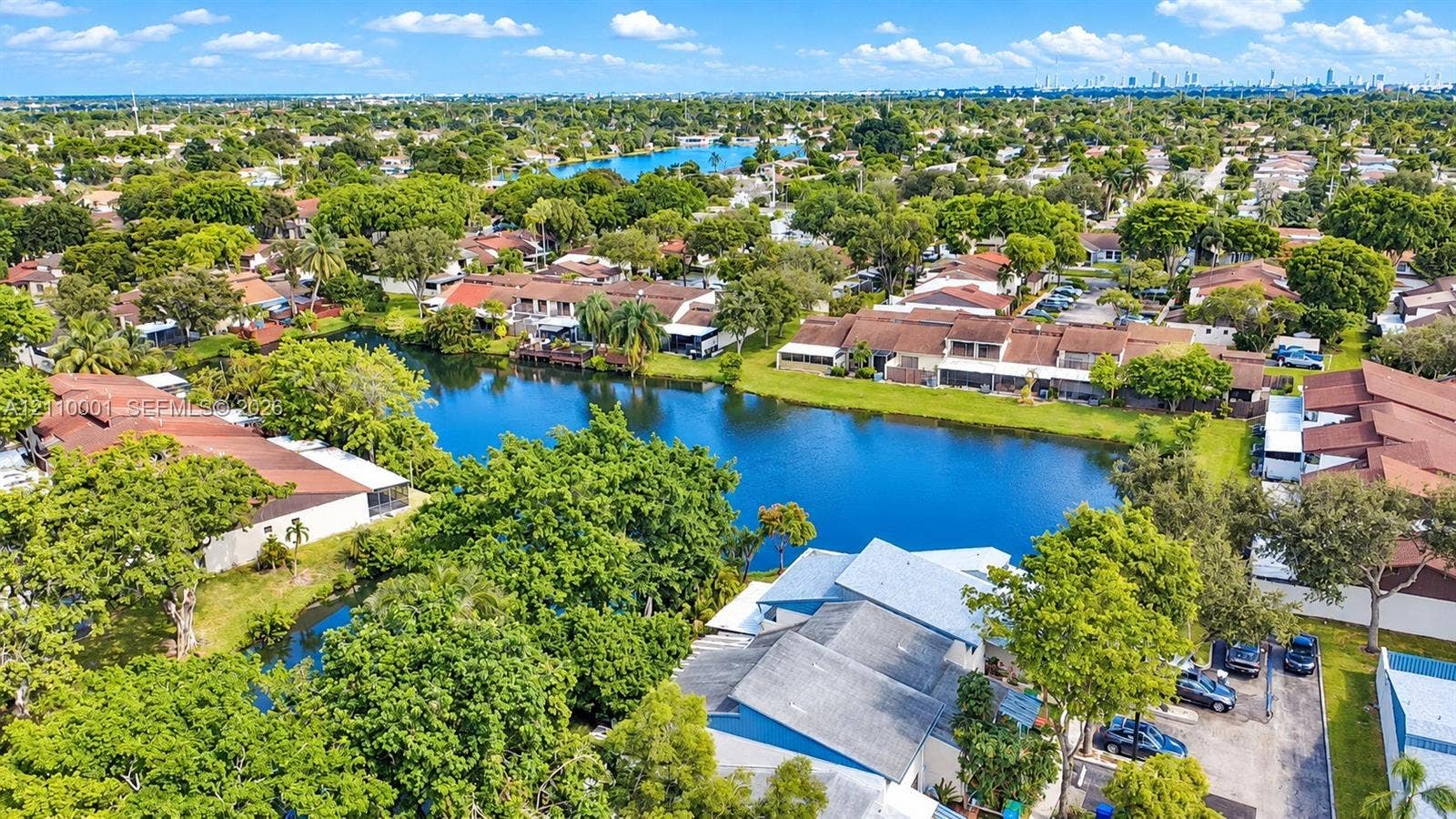 3617 SW 69th Terrace, #24-Z, Miramar, FL 33023 Aerial perspective featuring waterfront placement, mature tree canopy, and dense surrounding residential landscaping