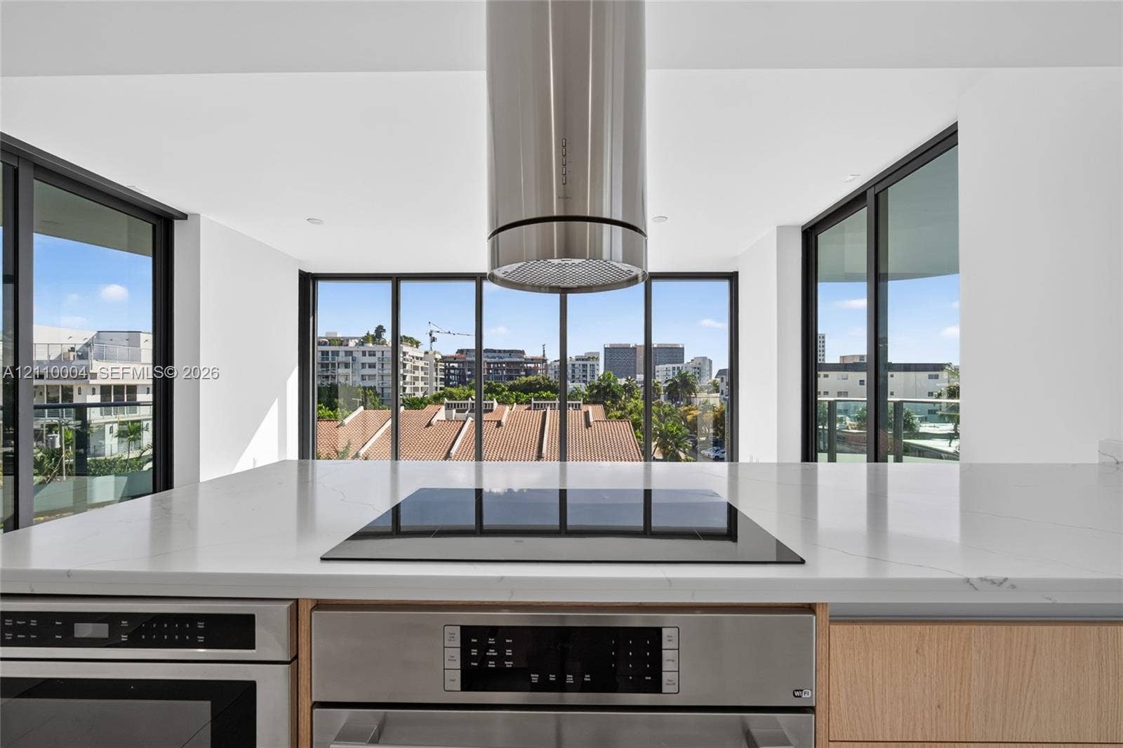 Kitchen featuring a stone-surface island