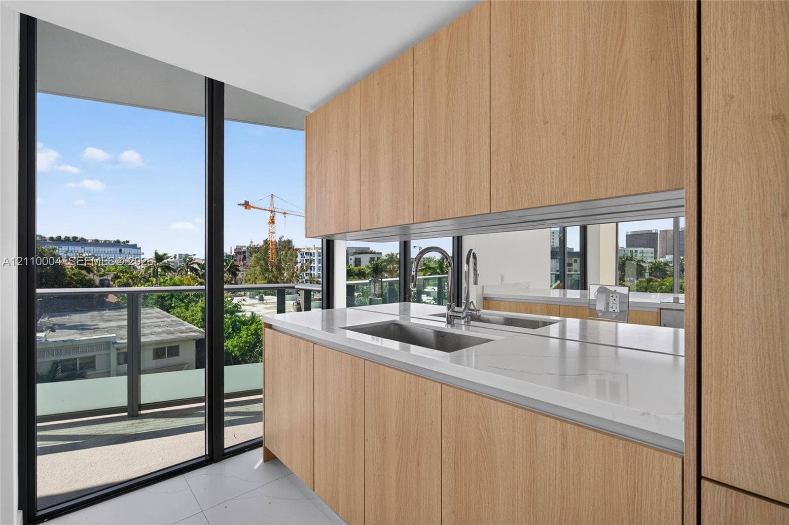 Kitchen featuring floor-to-ceiling windows