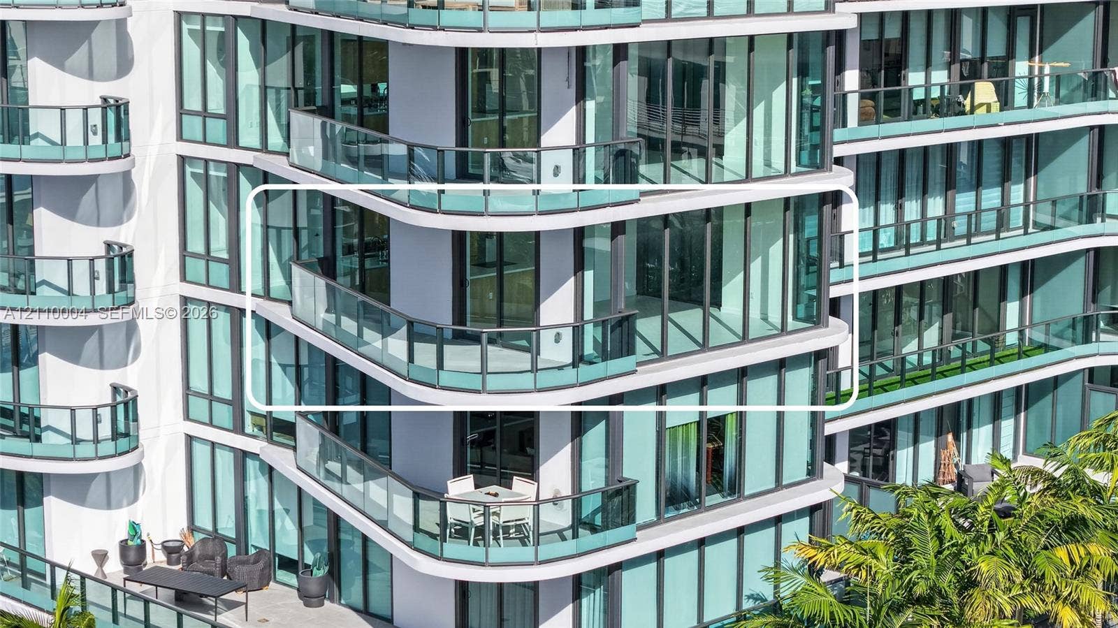 High-rise exterior featuring floor-to-ceiling glass windows