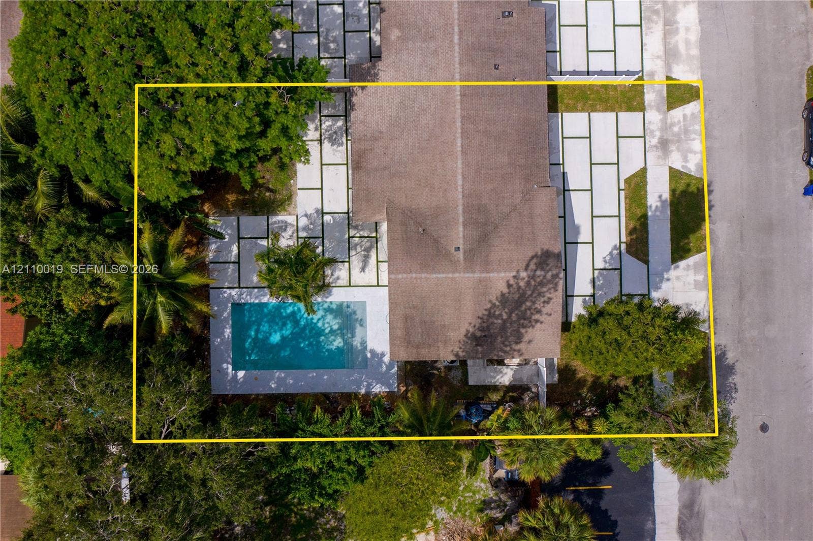 1708 SW 11th Street, Fort Lauderdale, Fort Lauderdale, FL 33312 Aerial view featuring a rectangular swimming pool, large-format paver hardscaping, mature trees, and a shingle roof