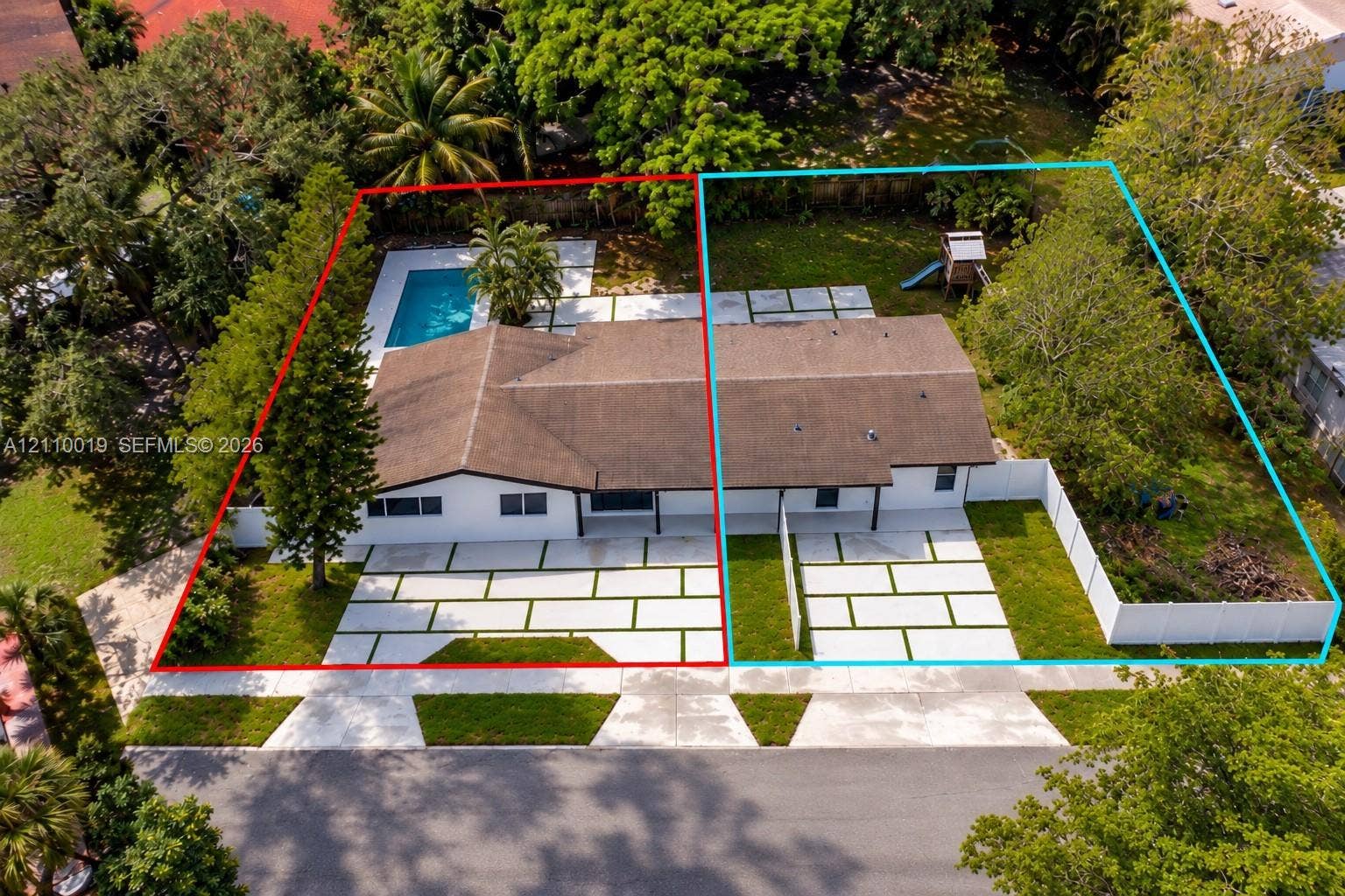 1708 SW 11th Street, Fort Lauderdale, Fort Lauderdale, FL 33312 Aerial perspective of two properties featuring concrete paver driveways with grass inlay, rectangular in-ground pool, white vinyl fencing, and mature landscaping