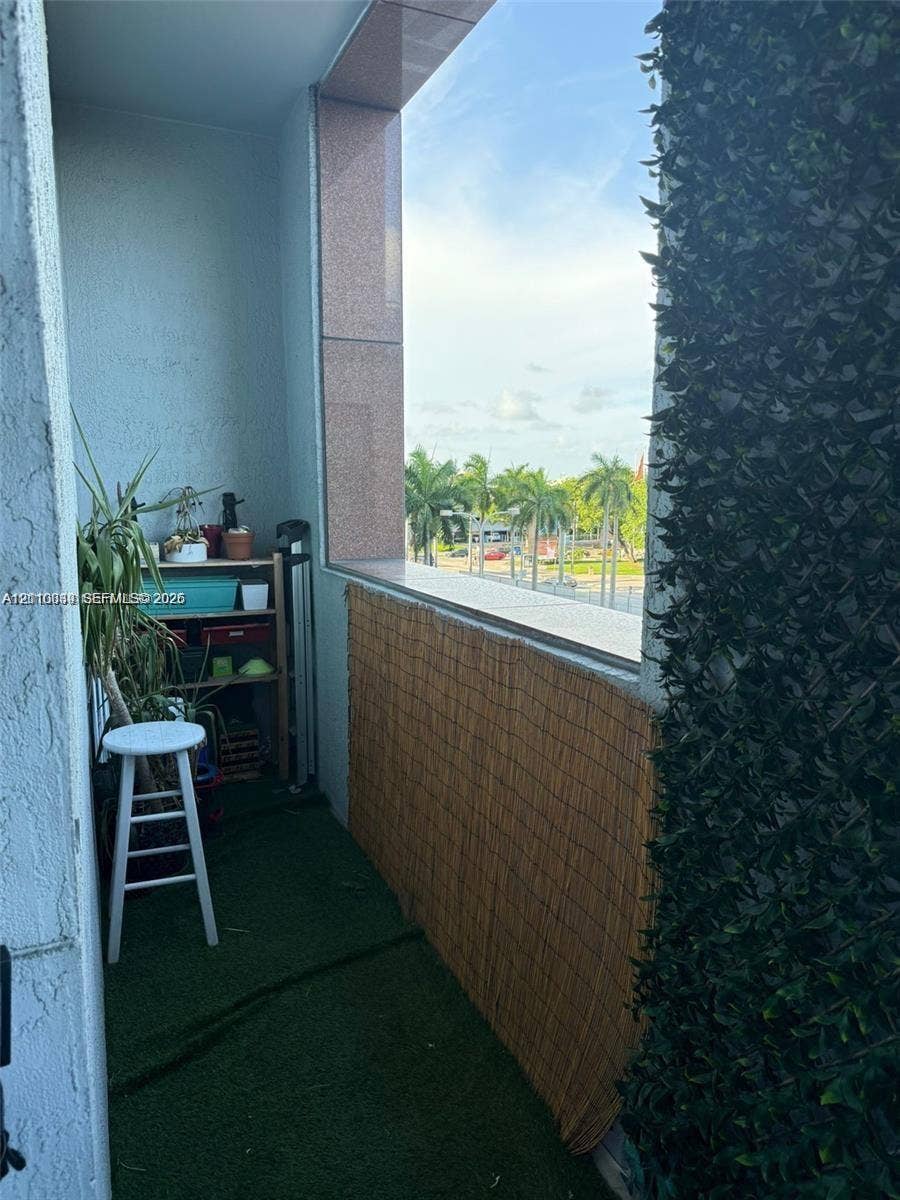 244 Biscayne Boulevard, #301, Miami, FL 33132 Private balcony featuring a textured stucco finish, stone-clad structural columns, and a wide ledge