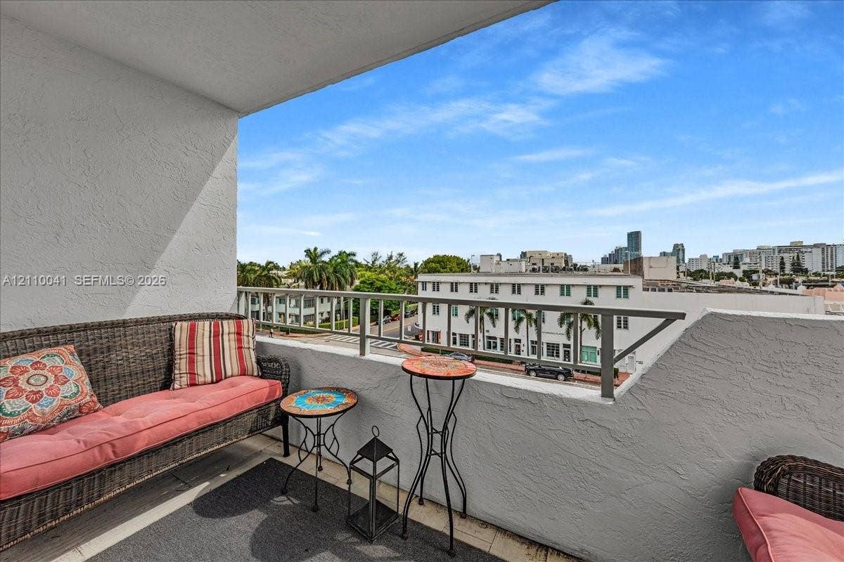 1610 Lenox Avenue, #516, Miami Beach, FL 33139 Covered balcony featuring textured stucco walls and a metal railing