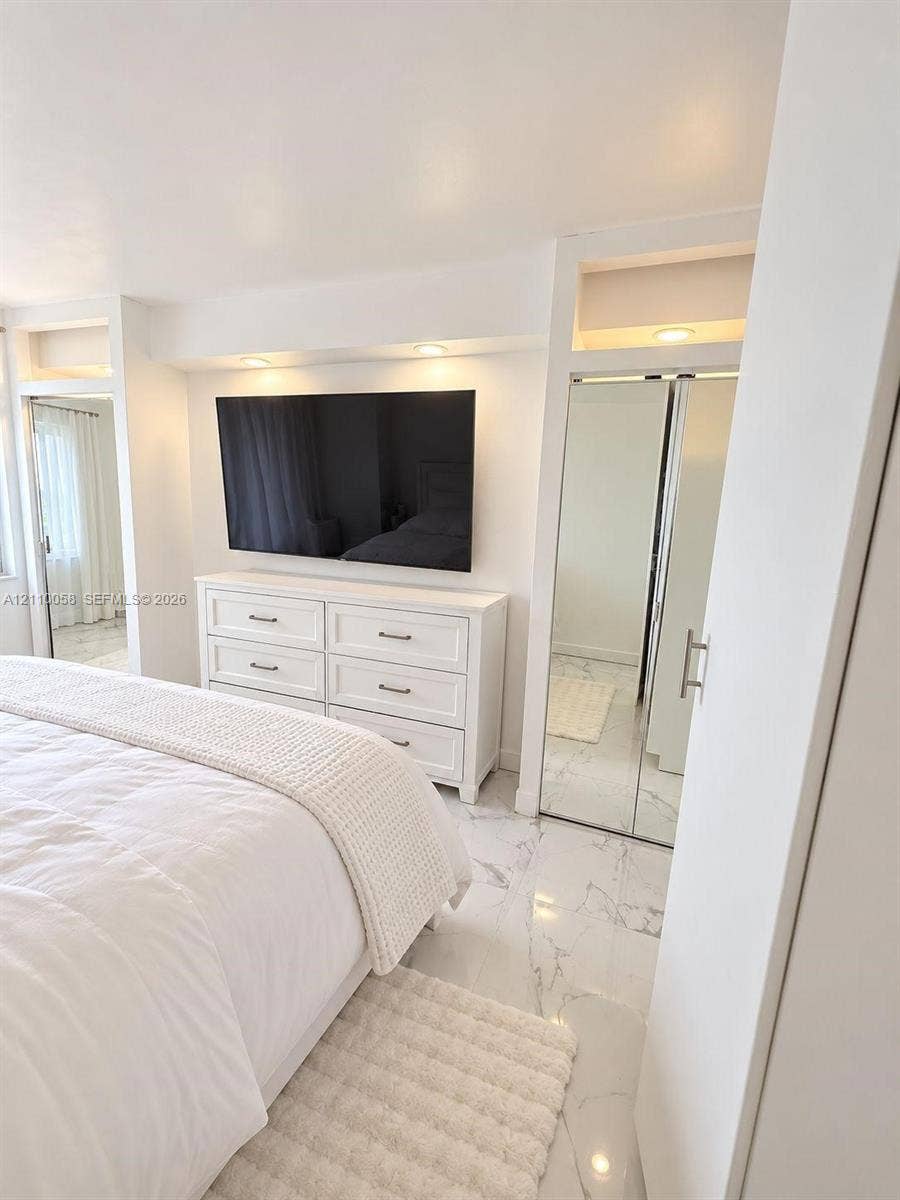 1950 S Ocean Drive, #3K, Hallandale Beach, Hallandale Beach, FL 33009 Stone-finish flooring, mirrored closet doors, and recessed ceiling lighting