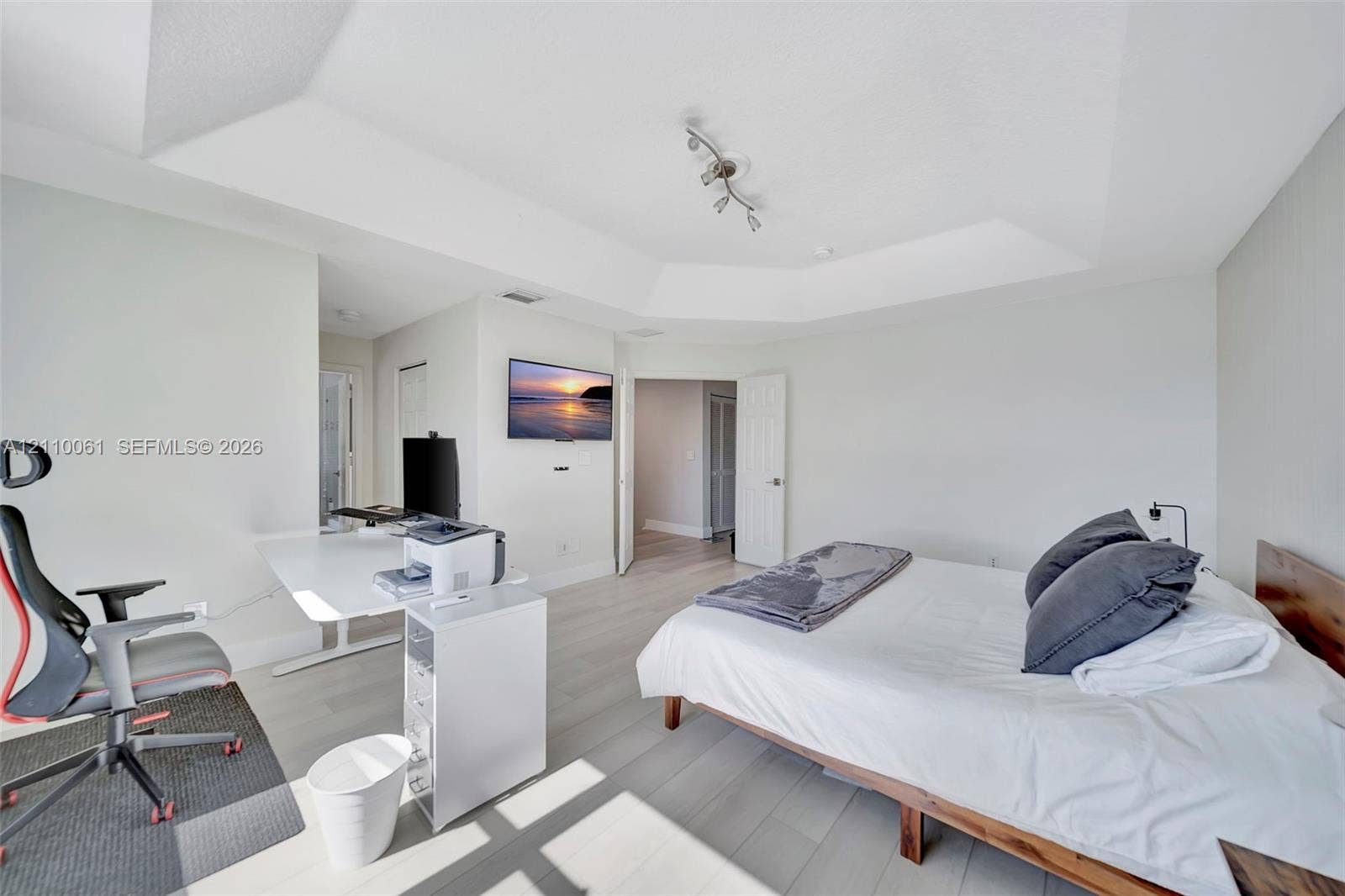 4424 E Whitewater Avenue, Weston, FL 33332 Tray ceiling, wood-finish flooring, and multi-directional track lighting