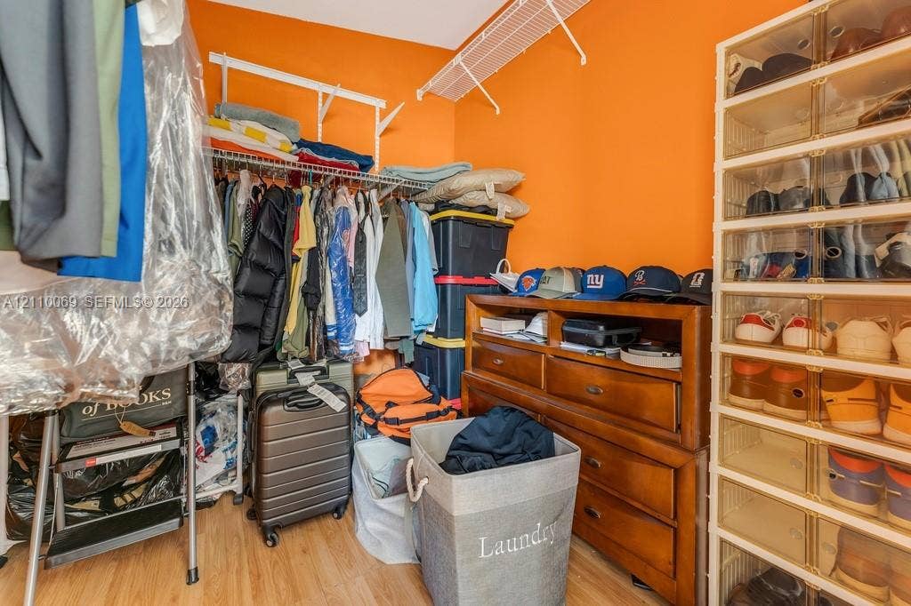 4325 NW 95th Terrace, Sunrise, FL 33351 Storage area featuring wood-finish flooring and tiered wire shelving