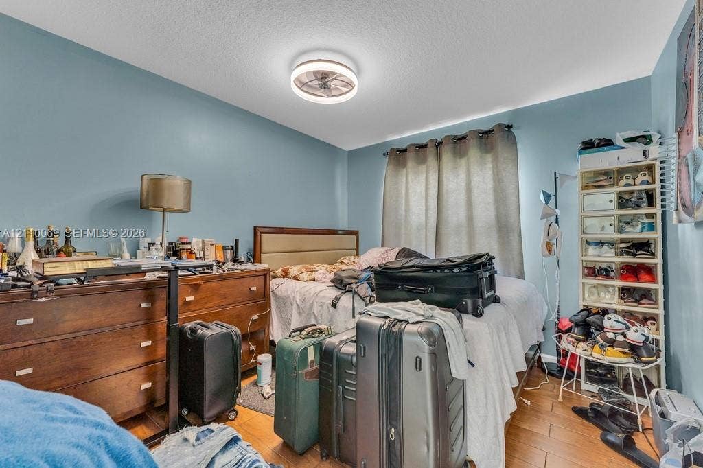 4325 NW 95th Terrace, Sunrise, FL 33351 Wood-finish flooring and a contemporary circular flush-mount ceiling fan