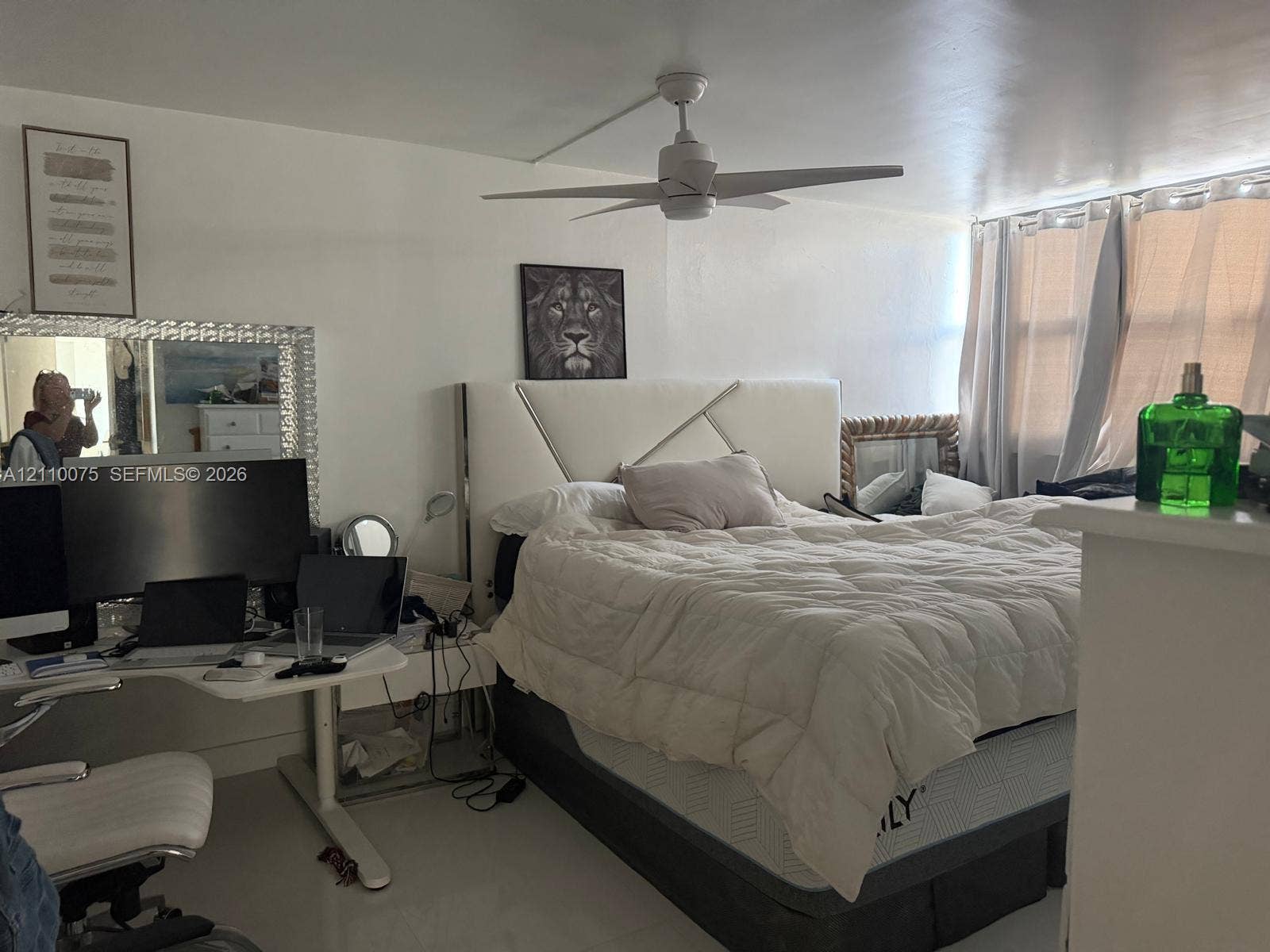 2017 S Ocean Drive, #208, Hallandale Beach, Hallandale Beach, FL 33009 White ceiling fan with integrated lighting and multi-pane windows