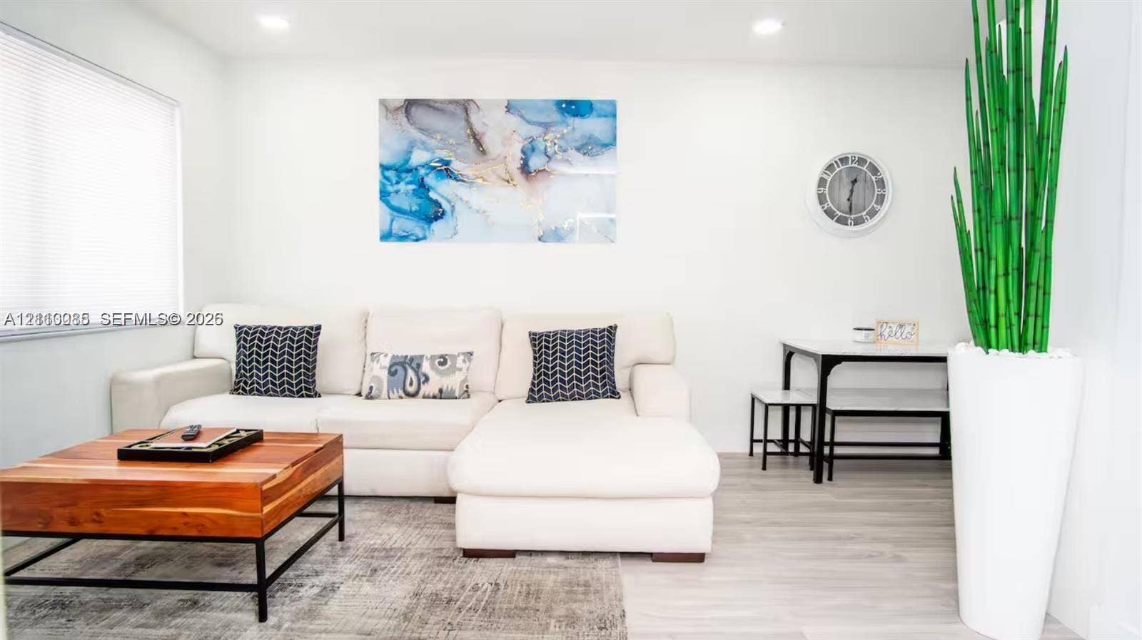 7815 NW 5th Court, #1, Miami, Miami, FL 33150 Neutral-toned interior featuring wood-finish flooring, recessed lighting, and horizontal window blinds