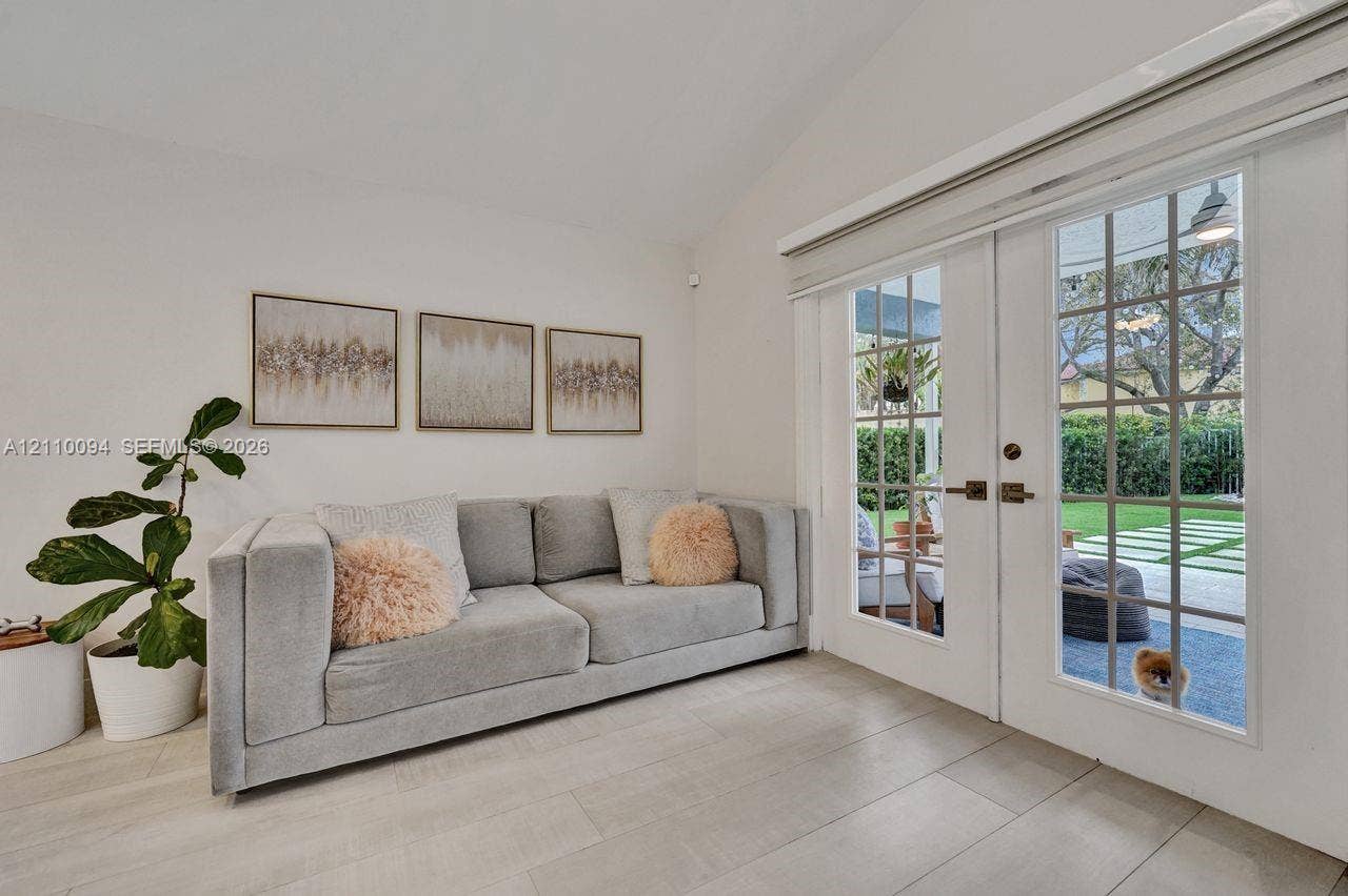 2064 Island Circle, Weston, FL 33326 Vaulted ceiling, neutral tile flooring, and multi-lite French doors