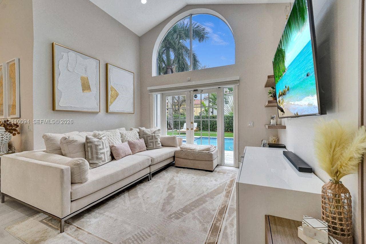 2064 Island Circle, Weston, FL 33326 Vaulted ceilings, arched transom window, French glass doors, and built-in floating shelving