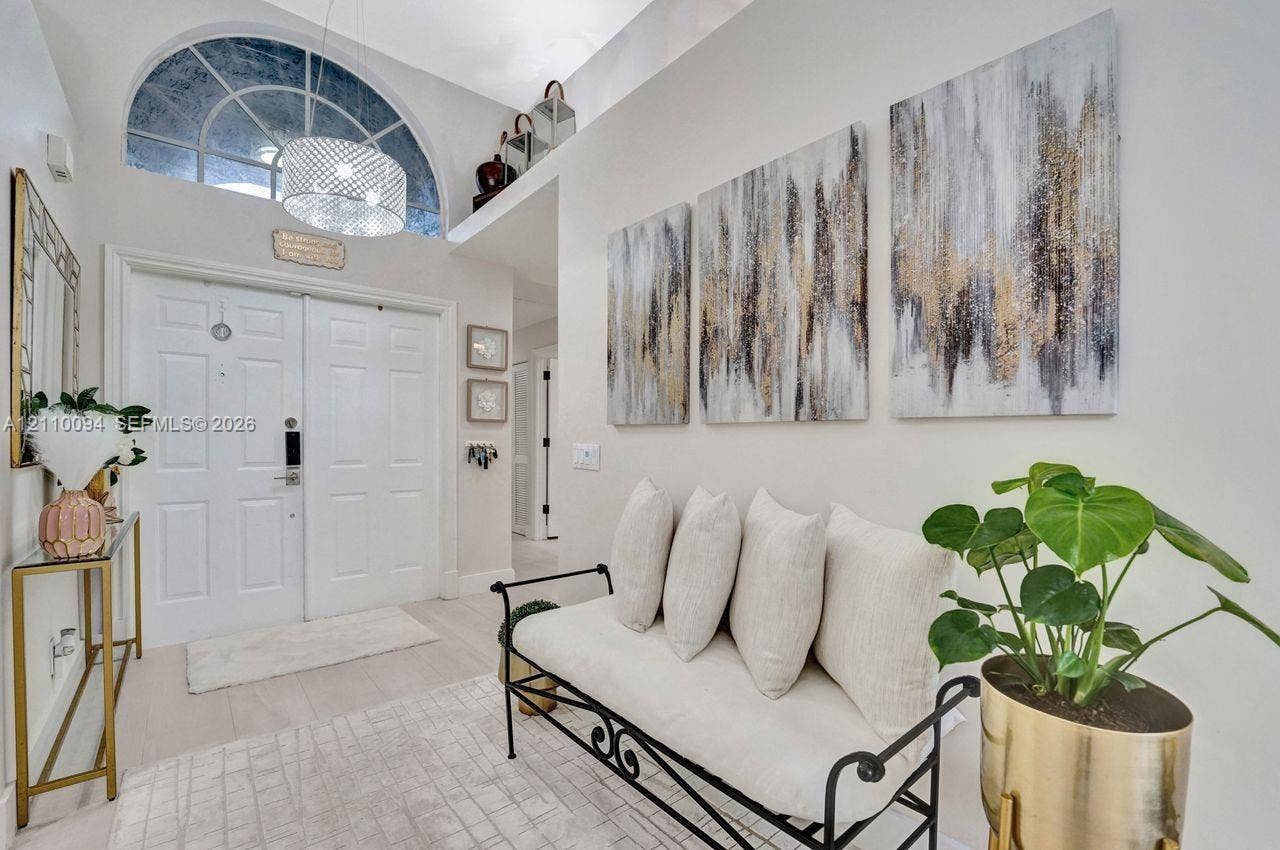 2064 Island Circle, Weston, FL 33326 Entryway featuring high ceilings, double entry doors, and a semi-circular transom window