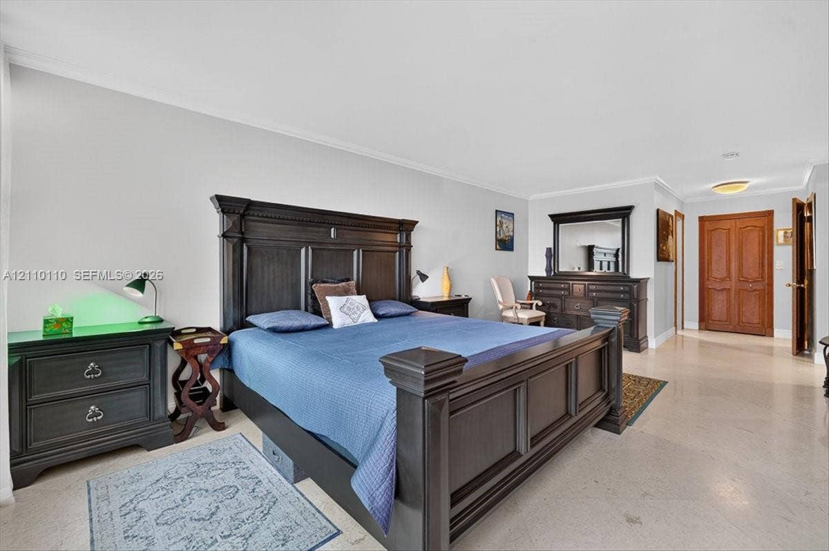 2751 S Ocean Drive, #801N, Hollywood, FL 33019 Spacious room featuring neutral wall tones, large-format stone-finish flooring, and solid wood double-panel doors